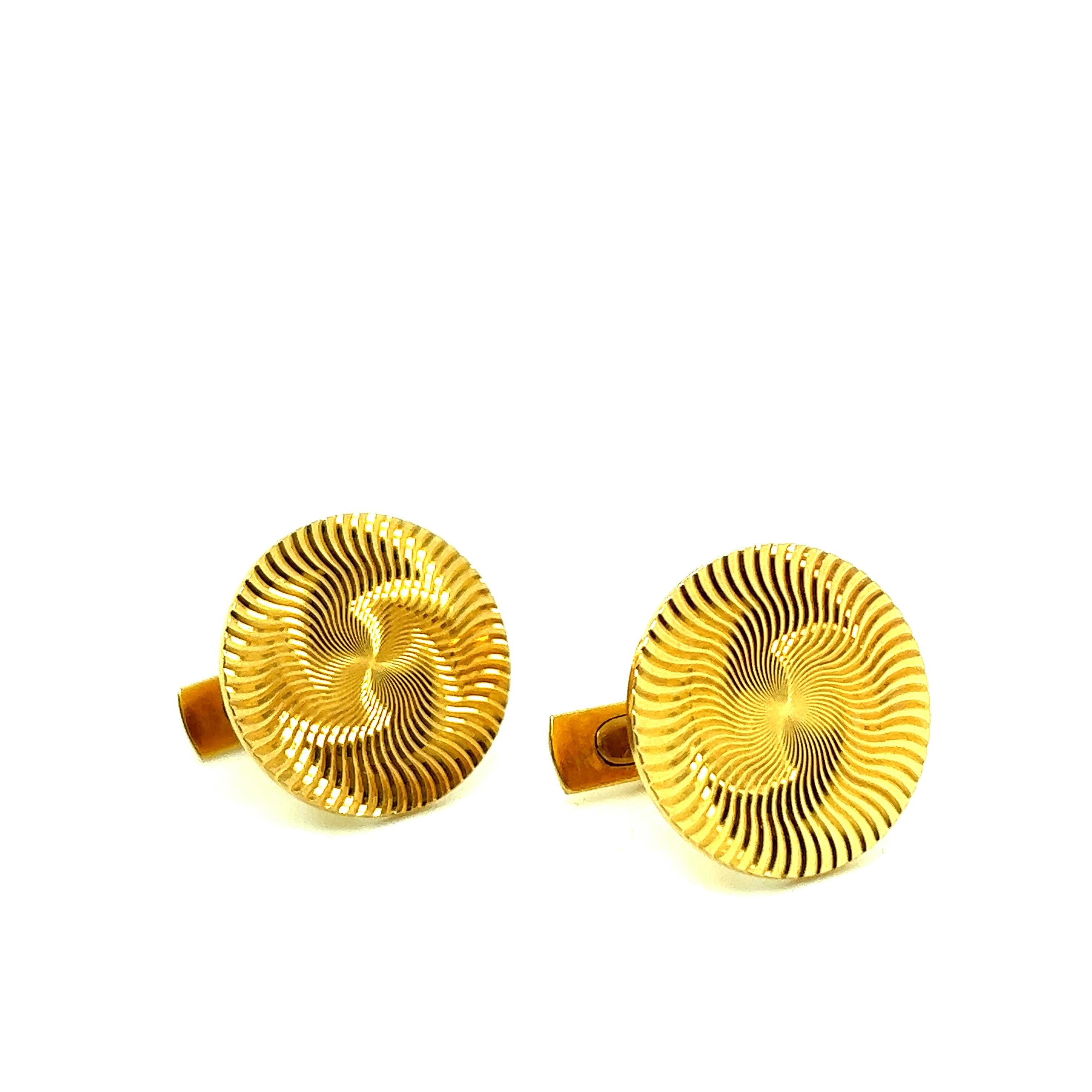 Bvlgari 18 karat yellow gold circle cufflinks that produce a unique design. Circa 1970s. Marked: Bvlgari / Italy / 18kt. Total weight: 21.2 grams. 