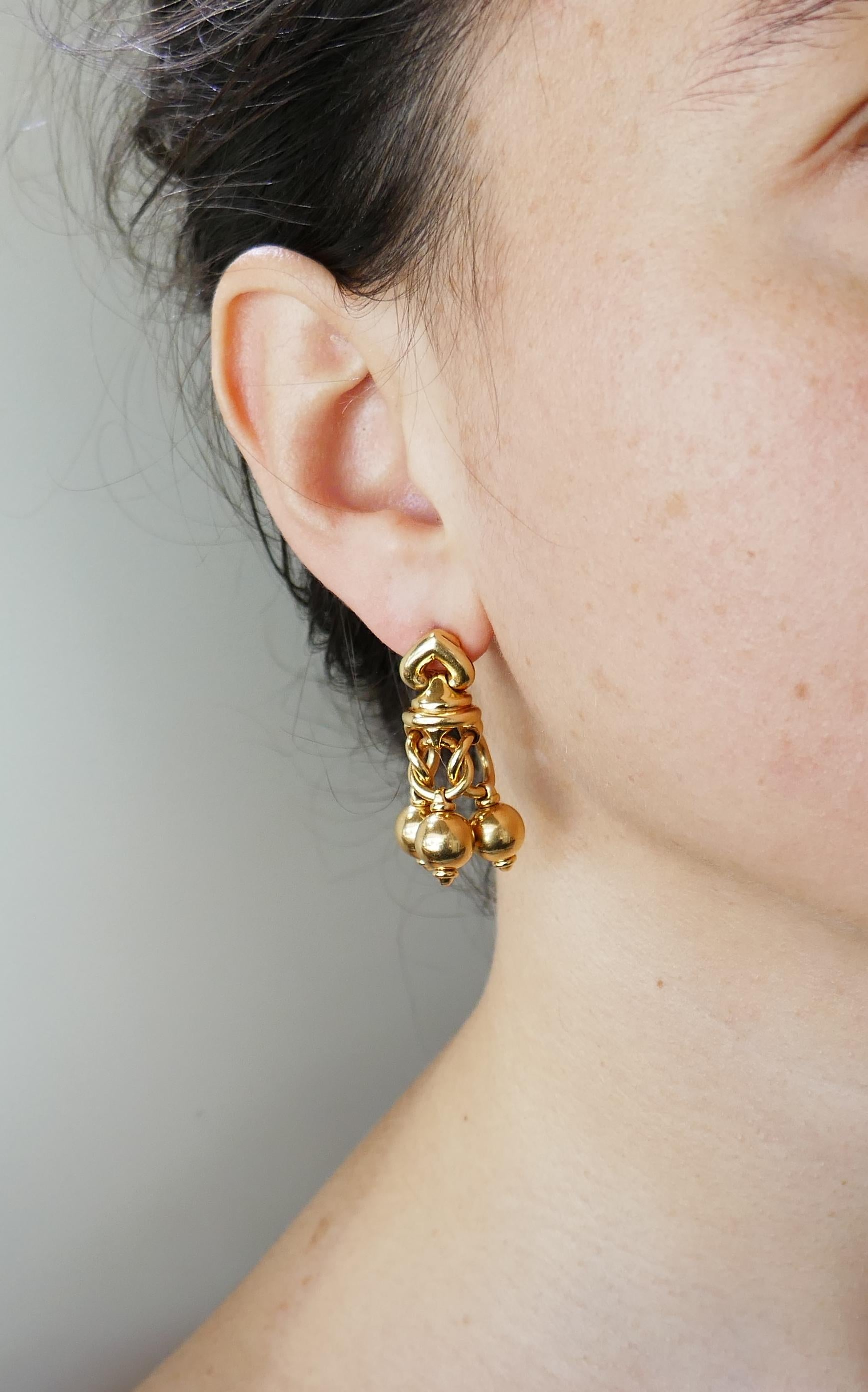 Classy dangle earrings created by Bvlgari in Italy in the 1980s. Elegant, timeless and wearable,  the earrings are a great addition to your jewelry collection. 
The earrings are made of 18 karat (stamped) yellow gold.
The earrings measure 1-1/4 x