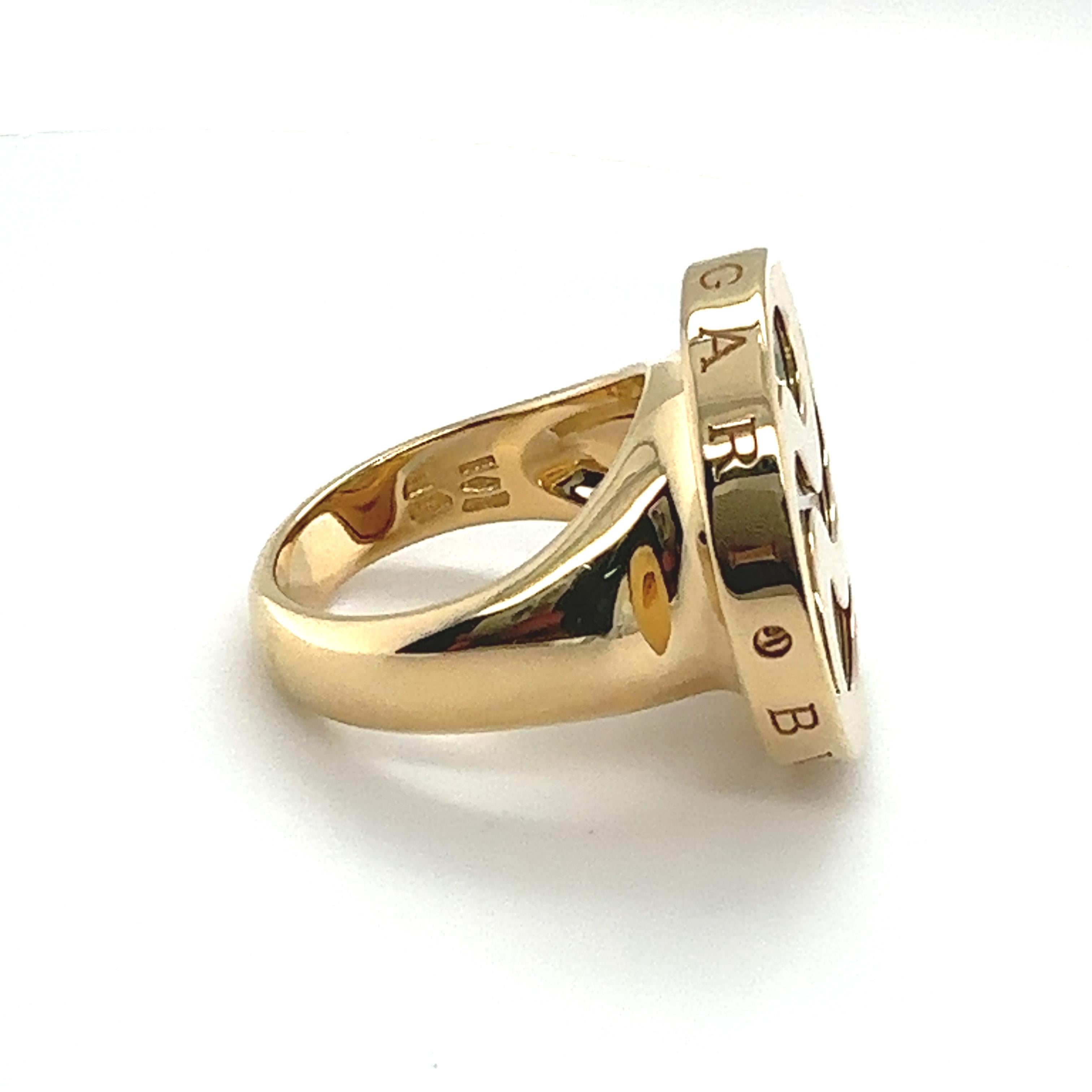 The BVLGARI Yellow Gold & Mother of Pearl Spinning Ring is such a cool piece! It's like having this shiny gold band with a pretty mother of pearl disk that spins around. You can't help but play with it, watching the colors change as it catches the