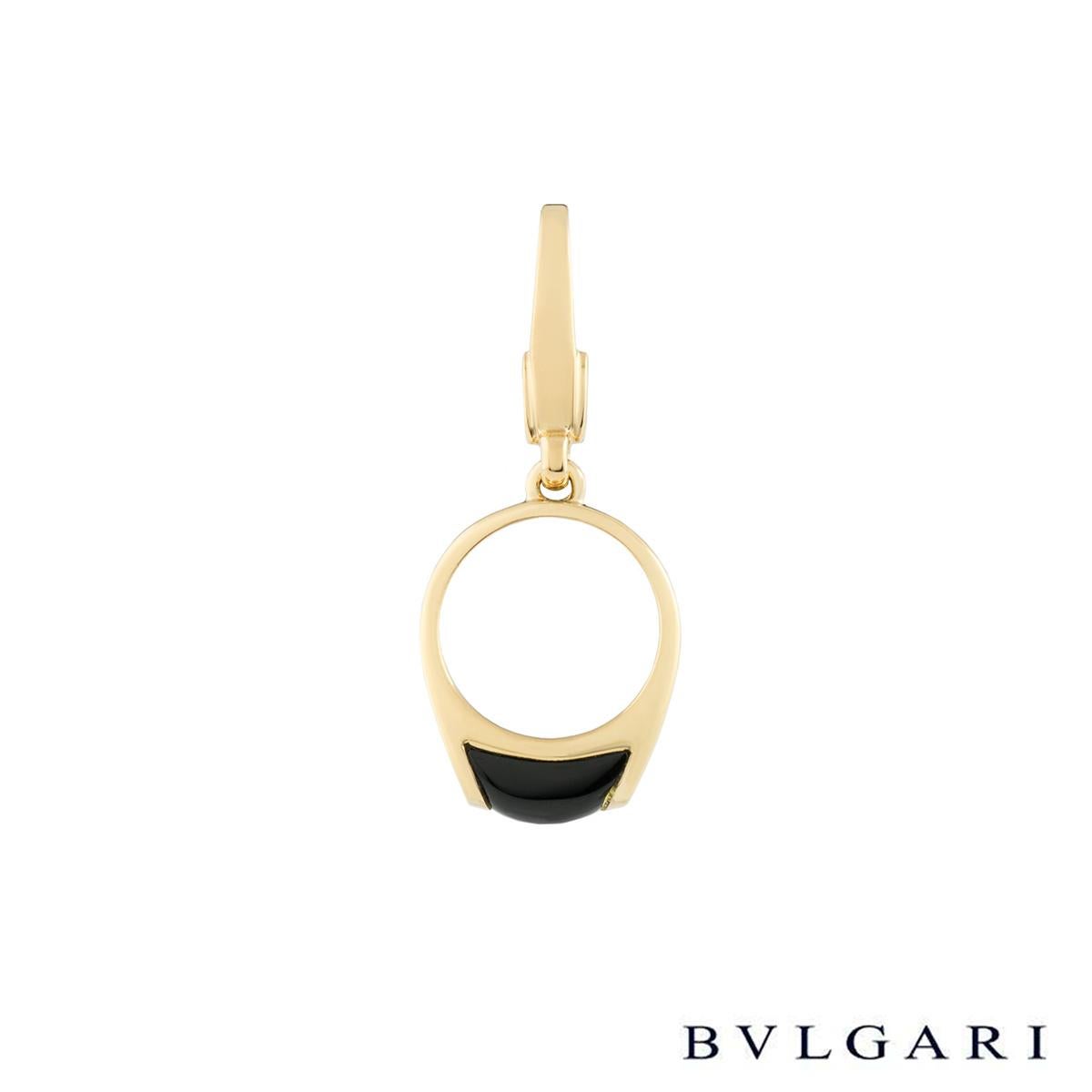 An elegant 18k white gold Bvlgari charm pendant. The pendant comprises of a ring motif with a onyx inlay in a tension setting. The pendant measures 3cm in length (including the bale) and 1.2cm in width. The charm has a gross weight of 2.90