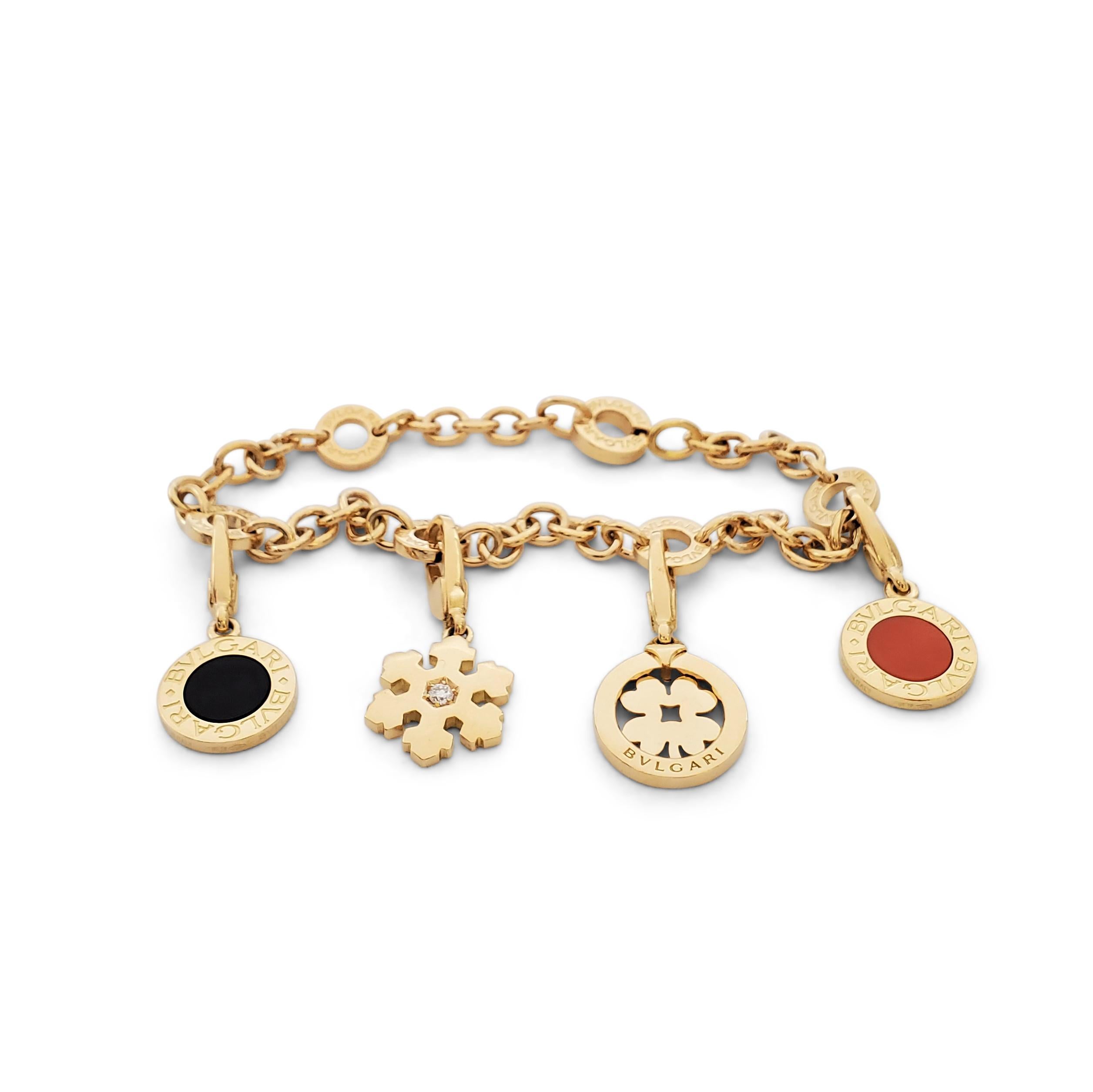 Authentic Bvlgari bracelet crafted in 18 karat yellow gold featuring four detachable charms that can be worn separately as pendants. Signed Bvlgari, Made in Italy, 750, with serial number. The bracelet measures 7 1/2 inches in length. Not presented