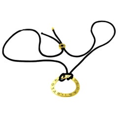 Bvlgari Yellow Gold Round Open with Black Silk Cord Necklace