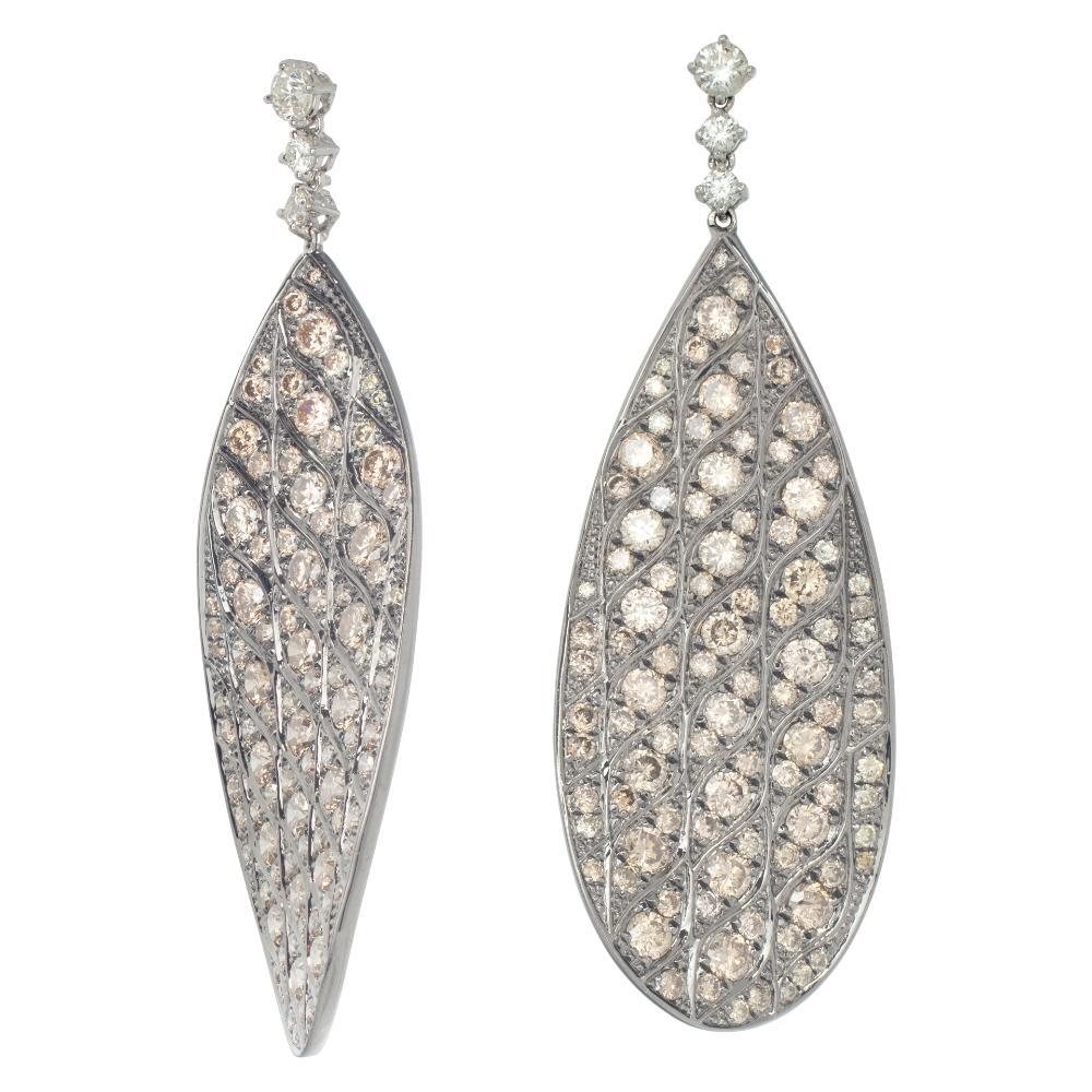 Dangling diamonds earrings in 18k white & black rhodium gold with over 5.50 carats round brilliant cut white & pink color diamonds.Hanging length 2.15 inches.
