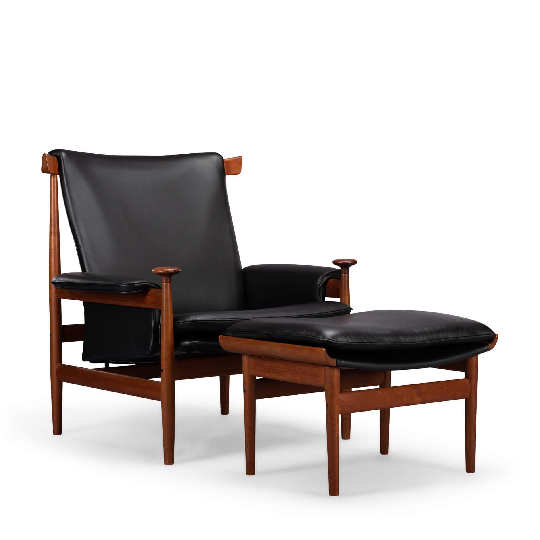 Bwana chair and ottoman by Finn Juhl for France & Søn in teak wood and reupholstered in a smooth black leather.

Excellent vintage condition with only a chip on the frame of the ottoman, see pictures.
With the Bwana chair Finn Juhl designed a