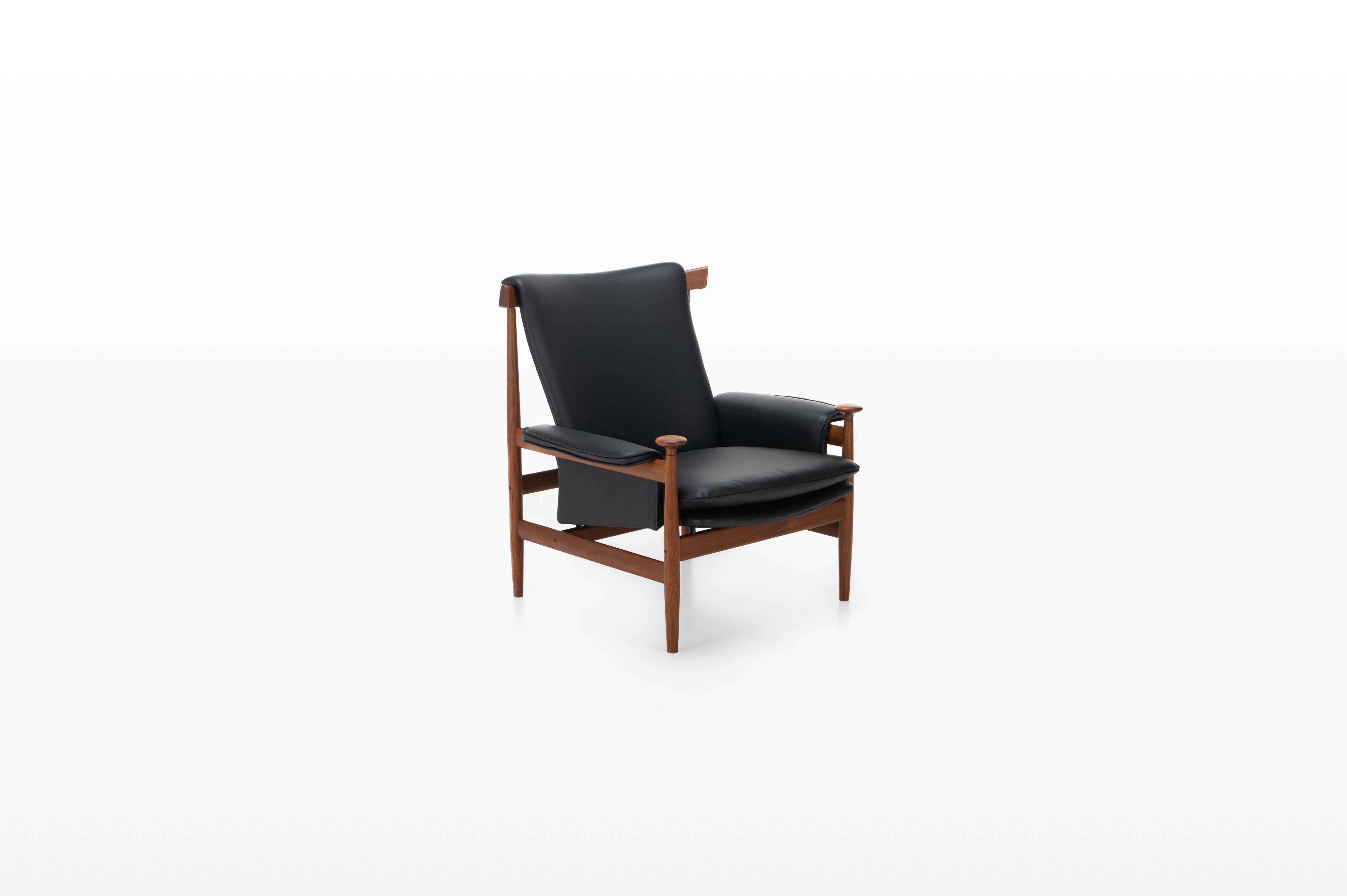 Beautiful Danish lounge chair designed by Finn Juhl. The Bwana chair was designed in 1962 by Finn Juhl for France & Son. This easy chair has been completely restored and re-upholstered in black leather.