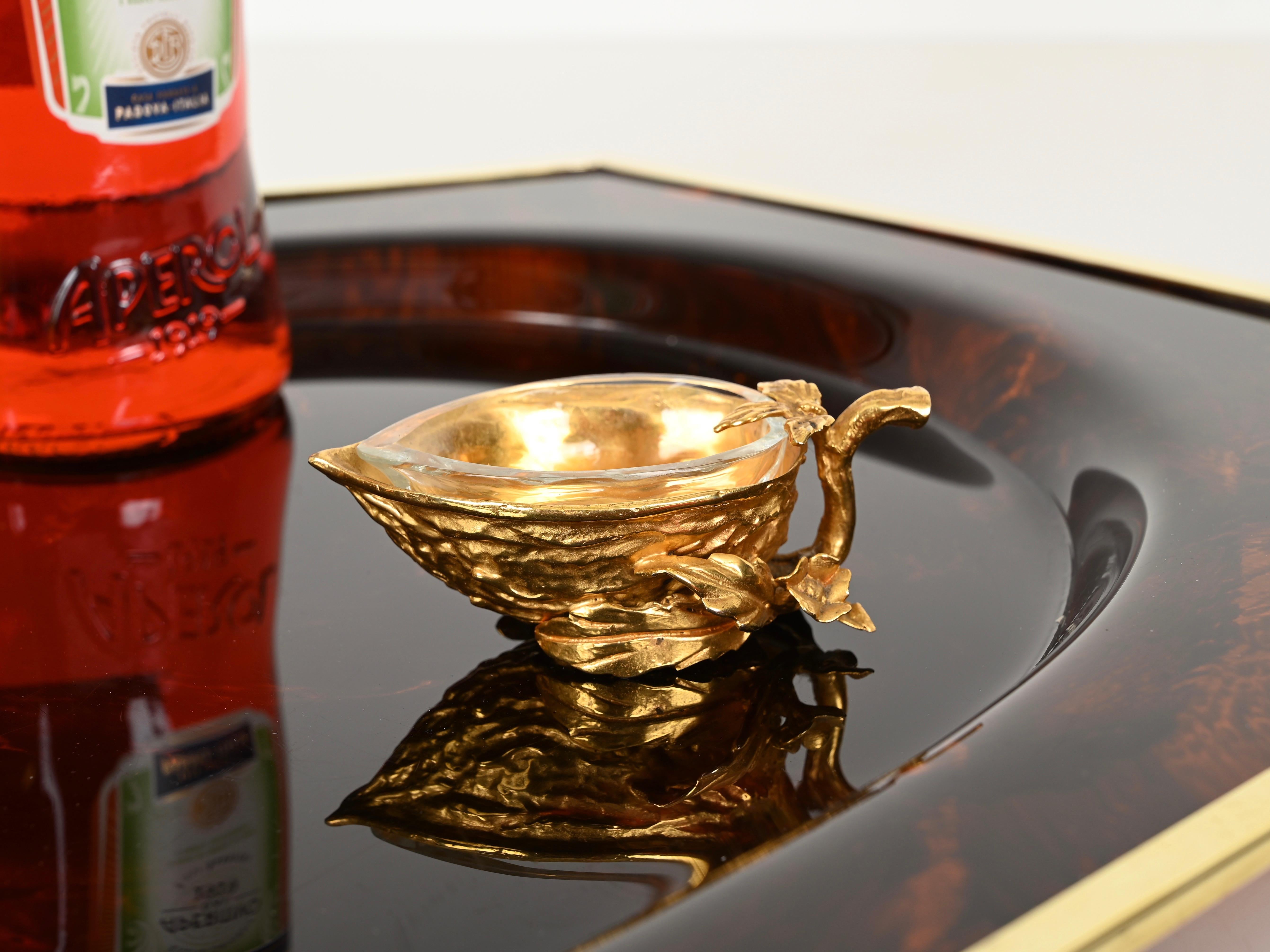 Exceptional and unique half walnut-shaped salt or spice container made in finely sculpted bronze and gilded in gold. Designed by Gabriella Crespi in Italy during the 1970s, the item is signed on the bottom. 

This marvelous piece is composed of two