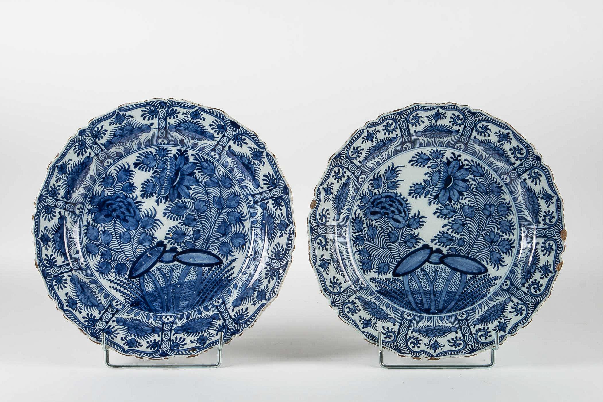 Sign by Ax Porcelain Factory, mid-18th century, magnificent pair of Faience Delft round dishes.

Magnificent and rare Delft pair of faience dishes, hand painted in a blue cameo, depicting foliages and flowers. These Blue and White Delft dishes