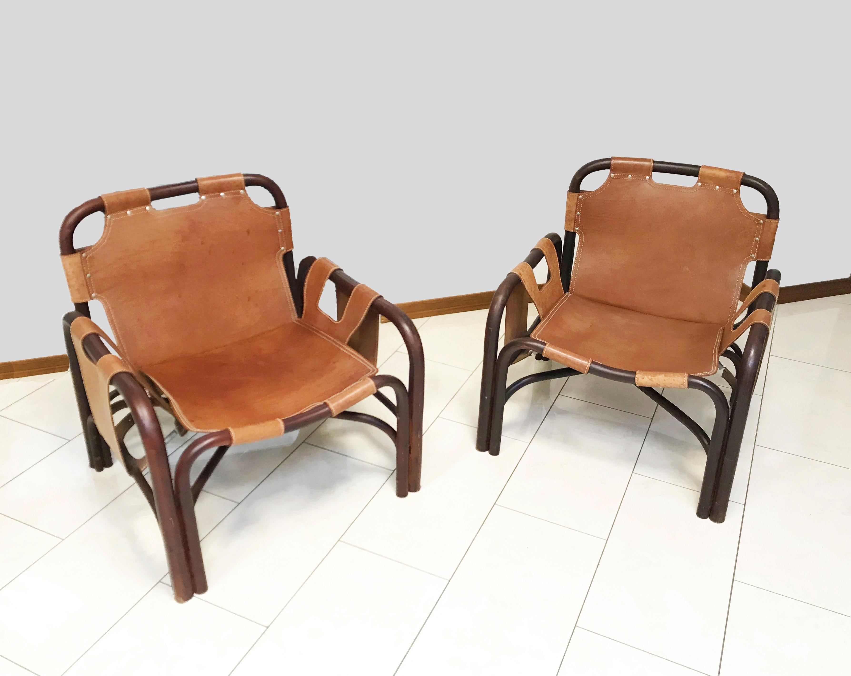 Tito Agnoli for Bonacina, Italy, 1960. Set of two rattan and leather armchairs. completely original. Good conditions. Some spots on the skin.