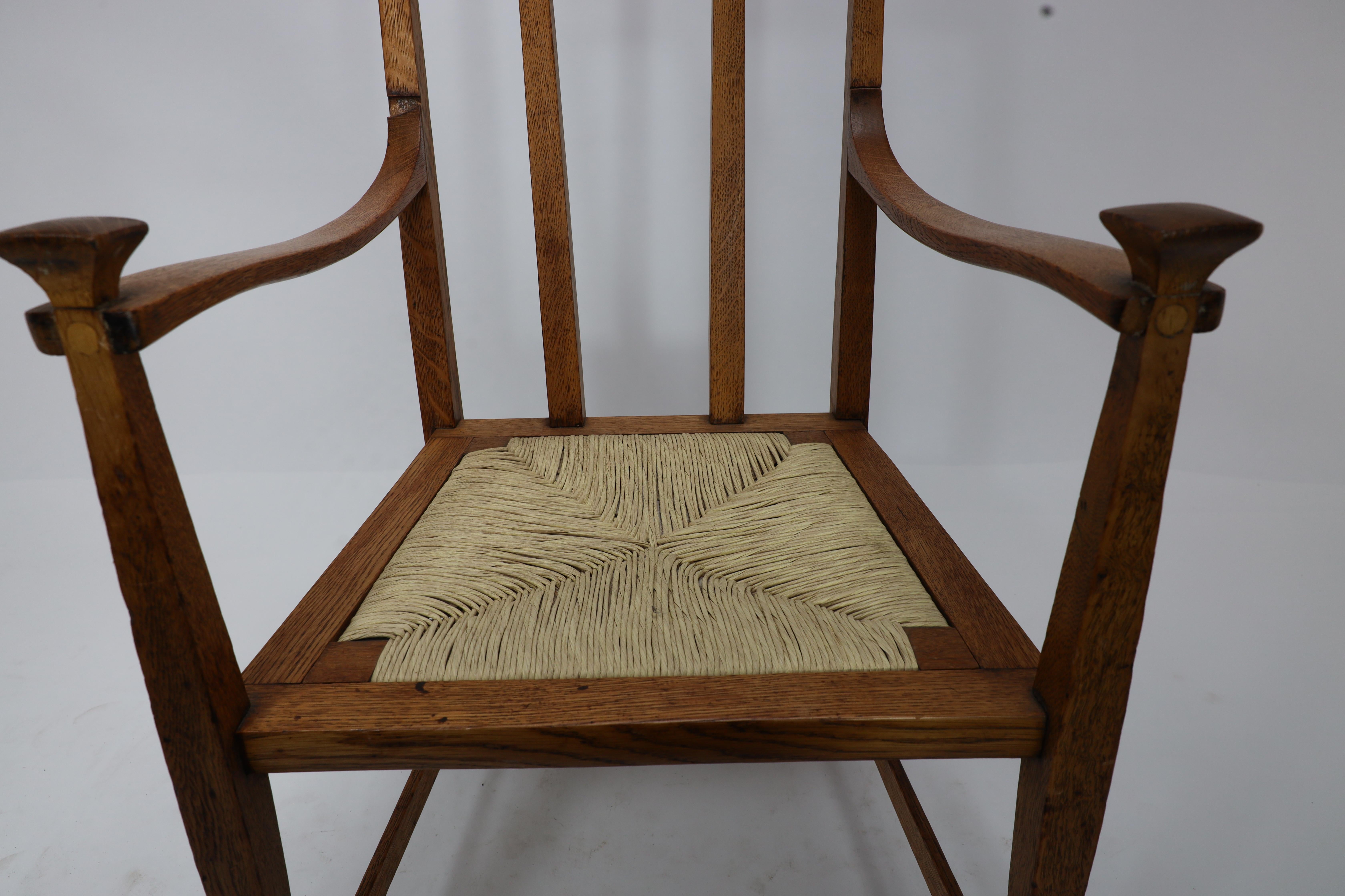 Oak J S Henry Arts & Crafts oak dining chair with throne like caps & a sweeping back For Sale