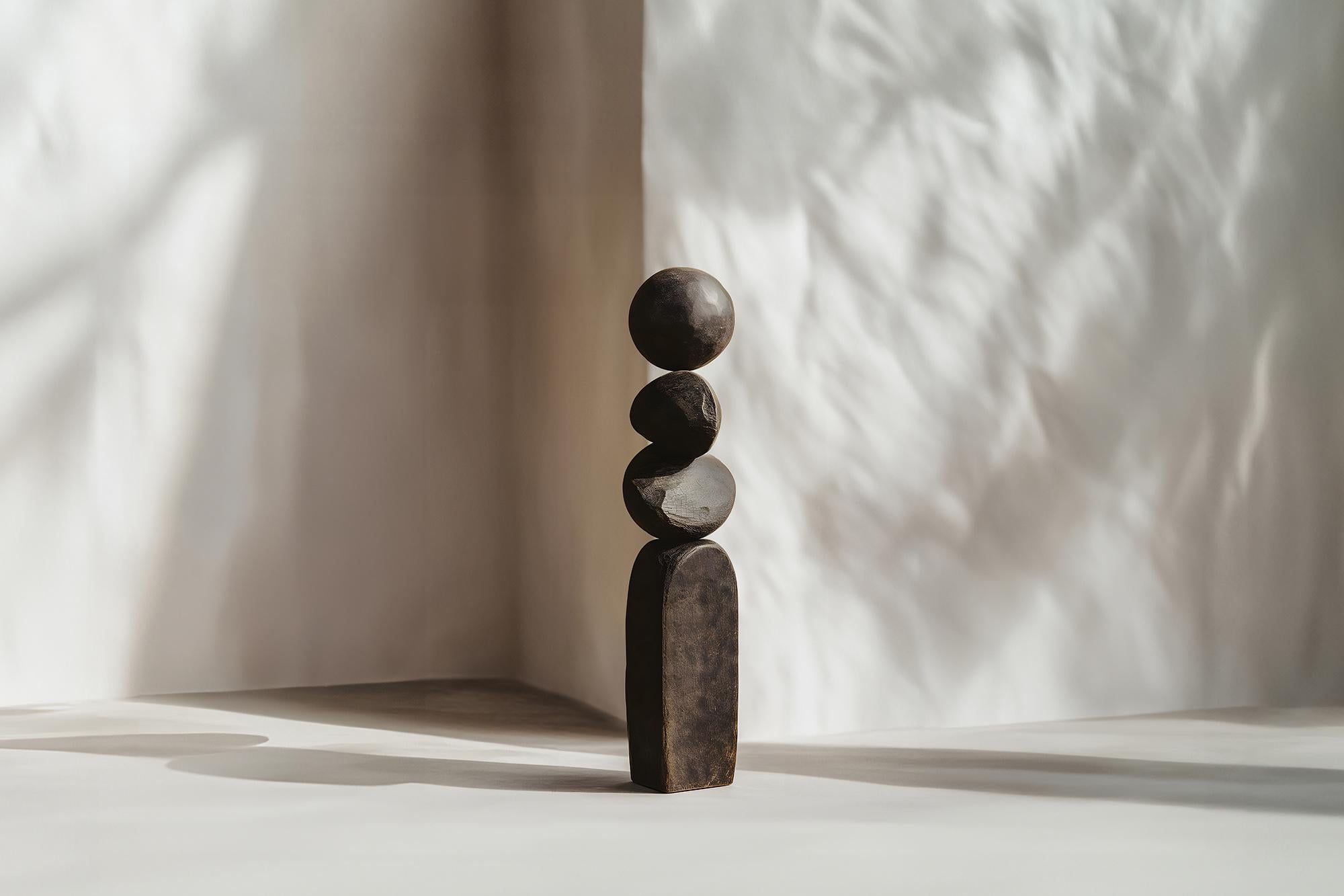 By Joel Escalona, Burned Oak Abstract Beauty, Still Stand No79
——


Joel Escalona's wooden standing sculptures are objects of raw beauty and serene grace. Each one is a testament to the power of the material, with smooth curves that flow into one