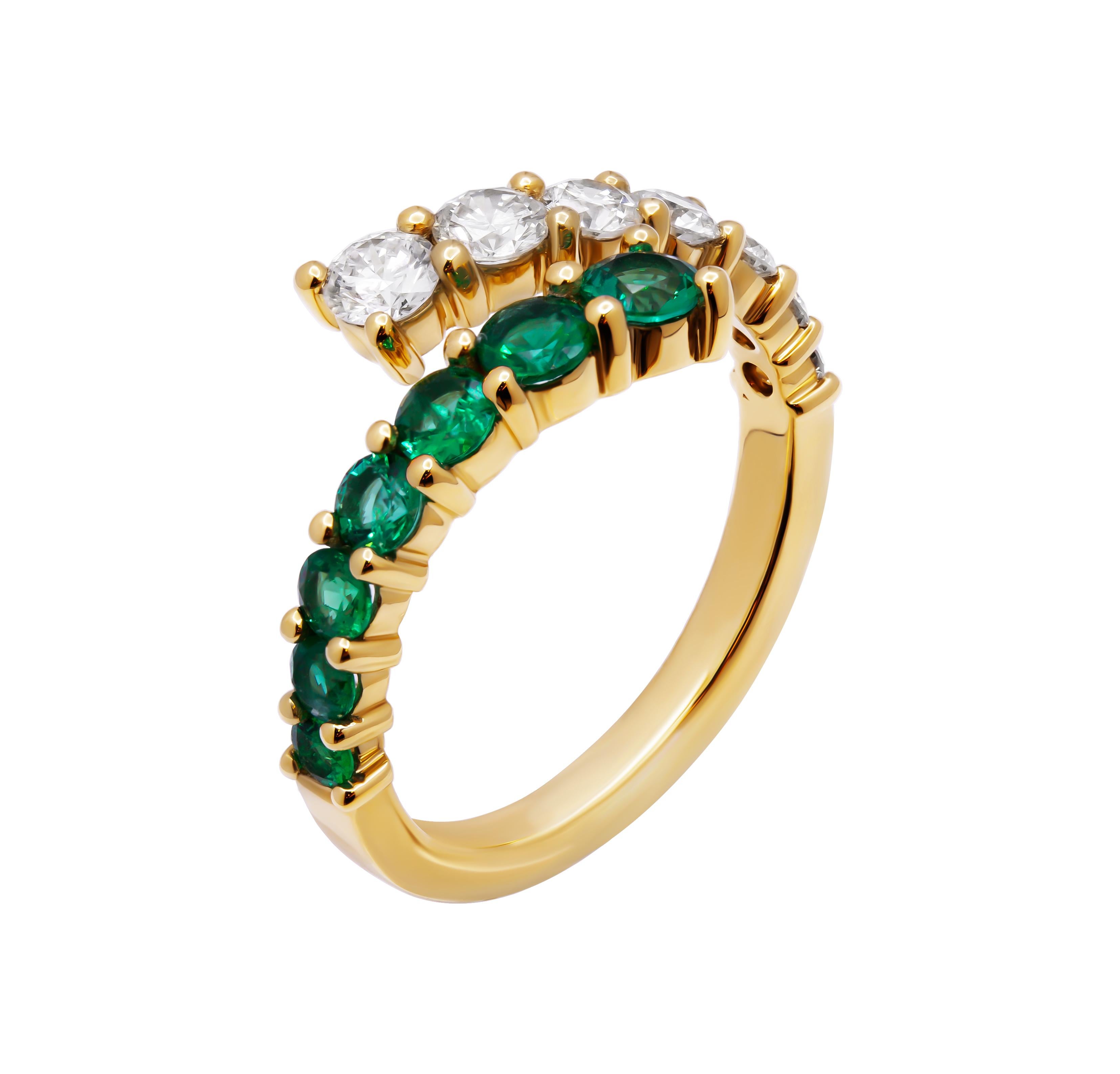 Discover the captivating elegance of this Bypass Ring, masterfully crafted in 14k yellow gold. This unique design features a stunning combination of white diamonds and a vibrant green emerald, creating a harmonious blend of classic and contemporary