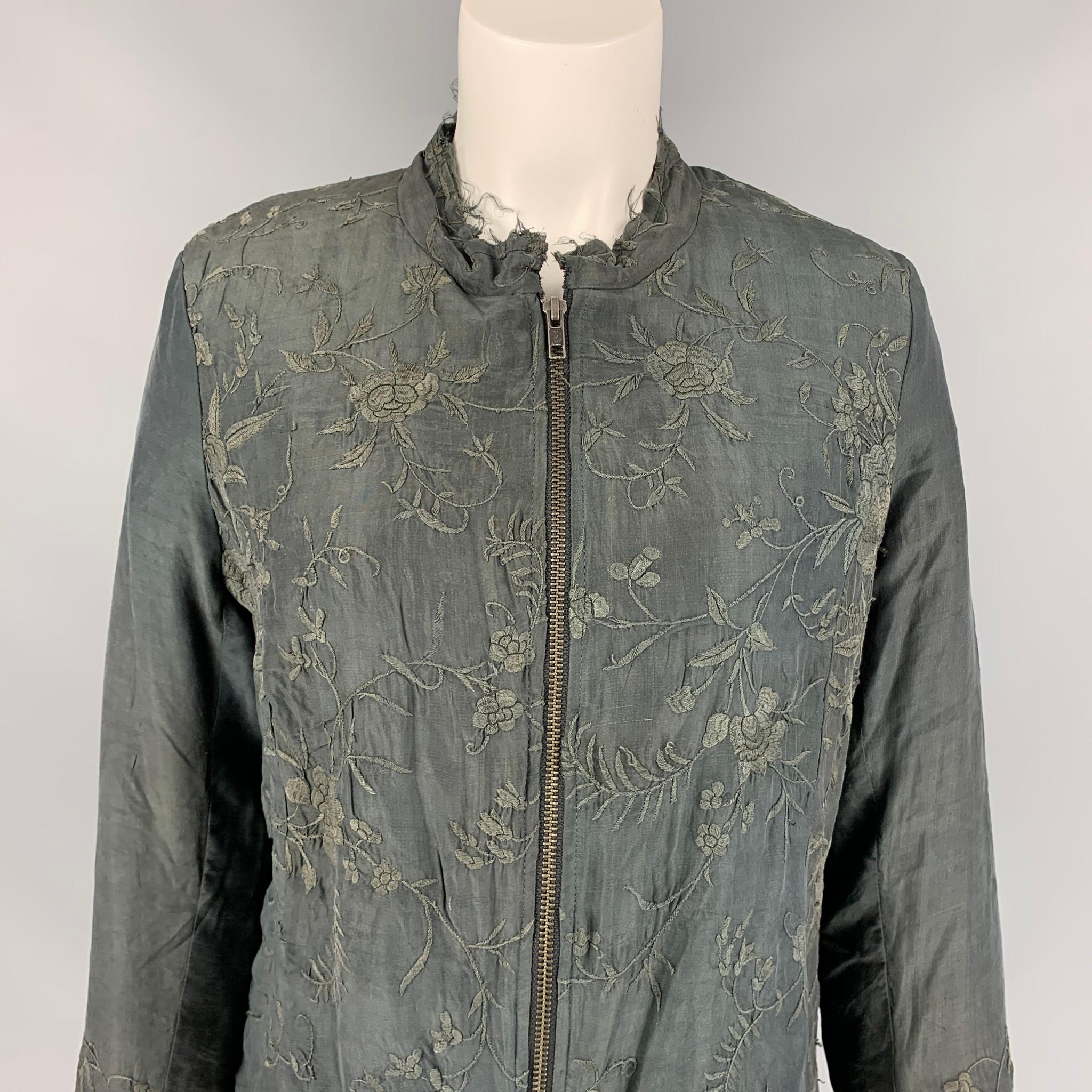 BY WALID jacket comes in a dark gray silk featuring embroidered design, raw edge, slit pockets, and a zip up closure. Made in UK. 

Very Good Pre-Owned Condition.
Marked: M

Measurements:

Shoulder: 16 in.
Bust: 40 in.
Sleeve: 25 in.
Length: 23.5
