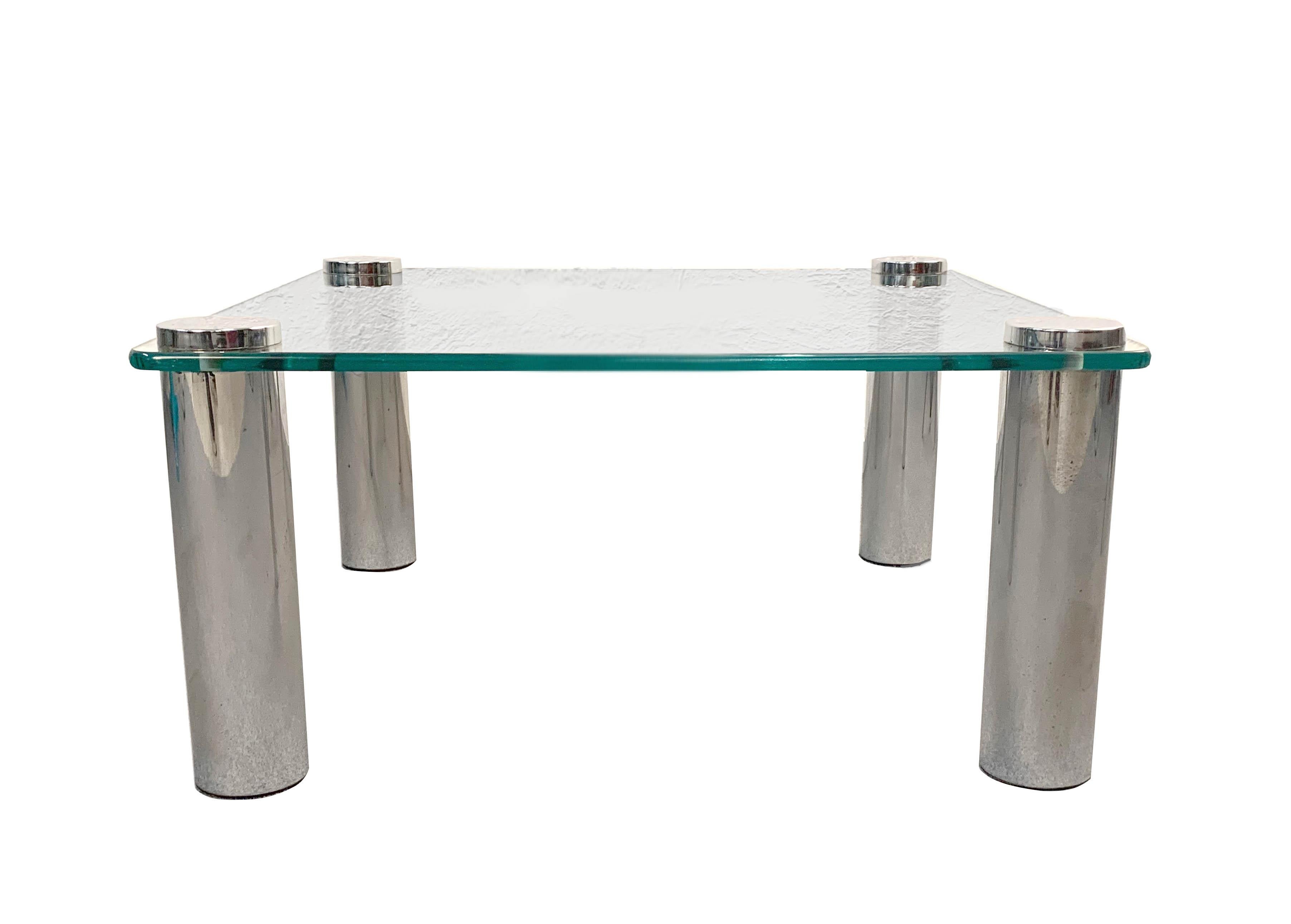 Marco Zanuso square coffee table for Zanotta. Italy, 1960s. Chrome-plated glass top.
Measures: 67.5 x 67.5 x 32 cm in height.