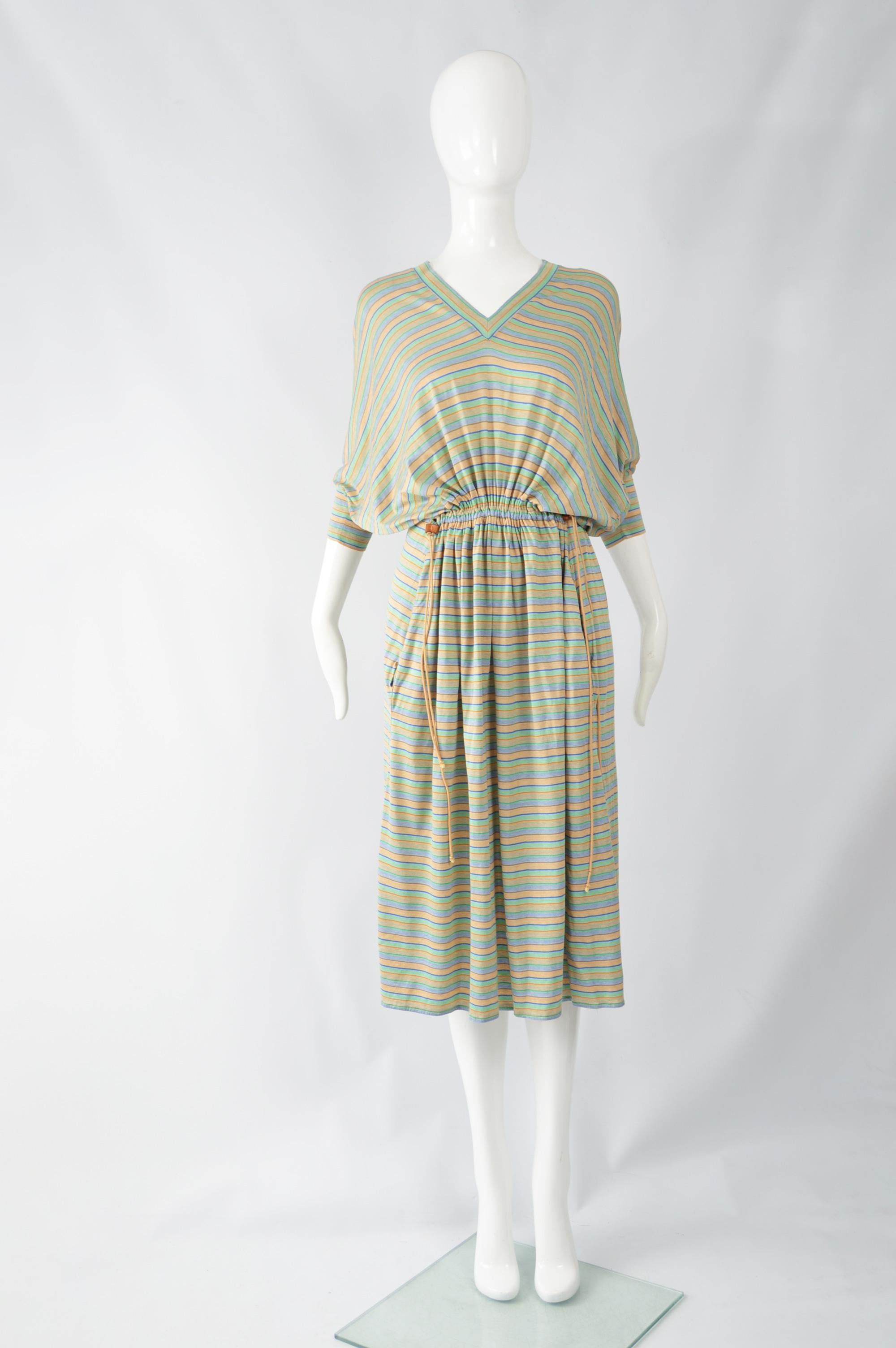 A chic and casual vintage women's dress from the mid to late 70s by iconic Italian fashion house Byblos (who Gianni Versace was head designer for in the 1970s, before starting his own label). In a casual, striped knit jersey with batwing details and