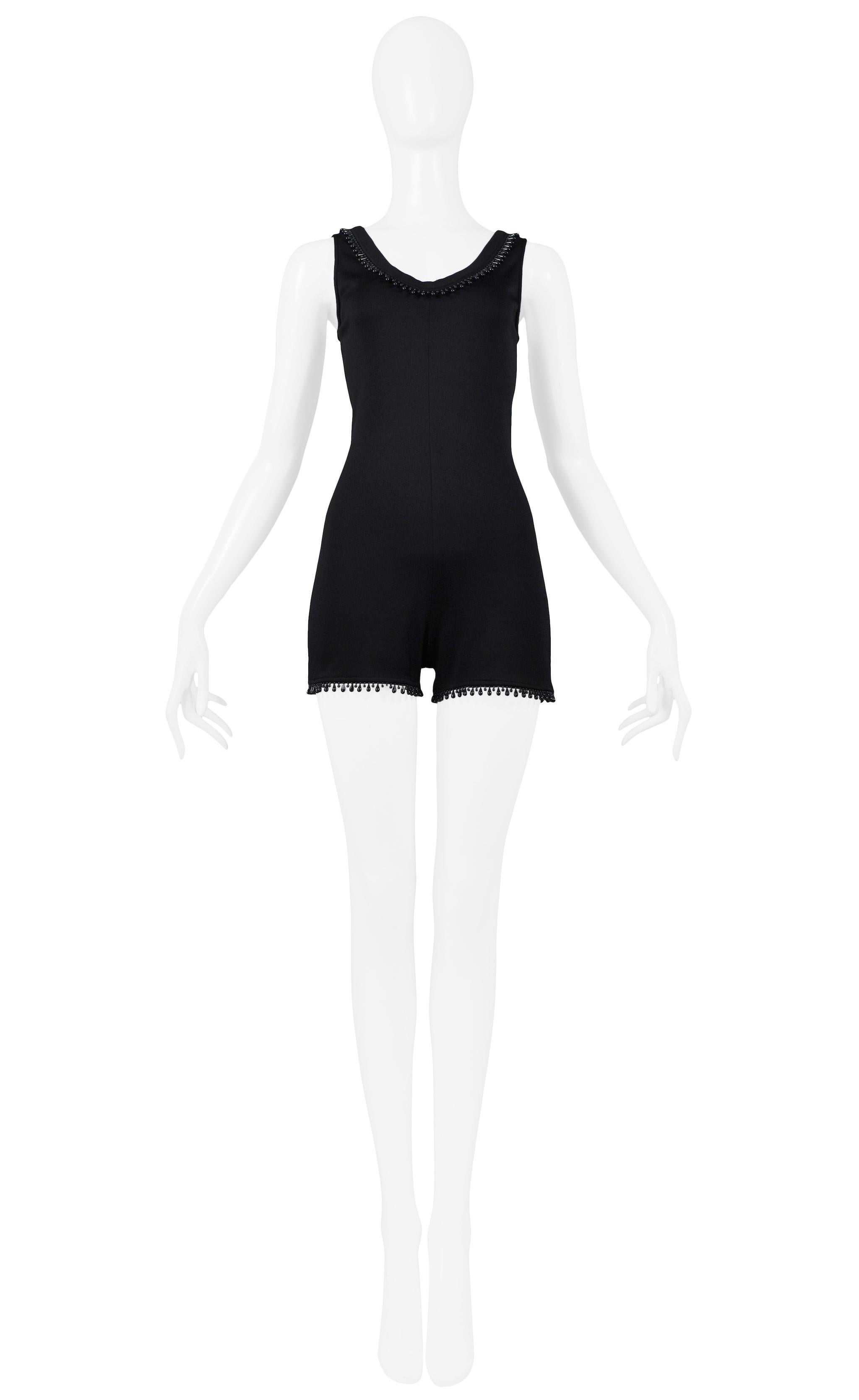 Resurrection Vintage is excited to offer a Byblos black cotton jersey knit sleeveless romper with black teardrop beading along neckline and hem. 
Byblos
Designed by Alan Cleaver and Keith Varty
Size Small / Medium
Jersey Knit
1992