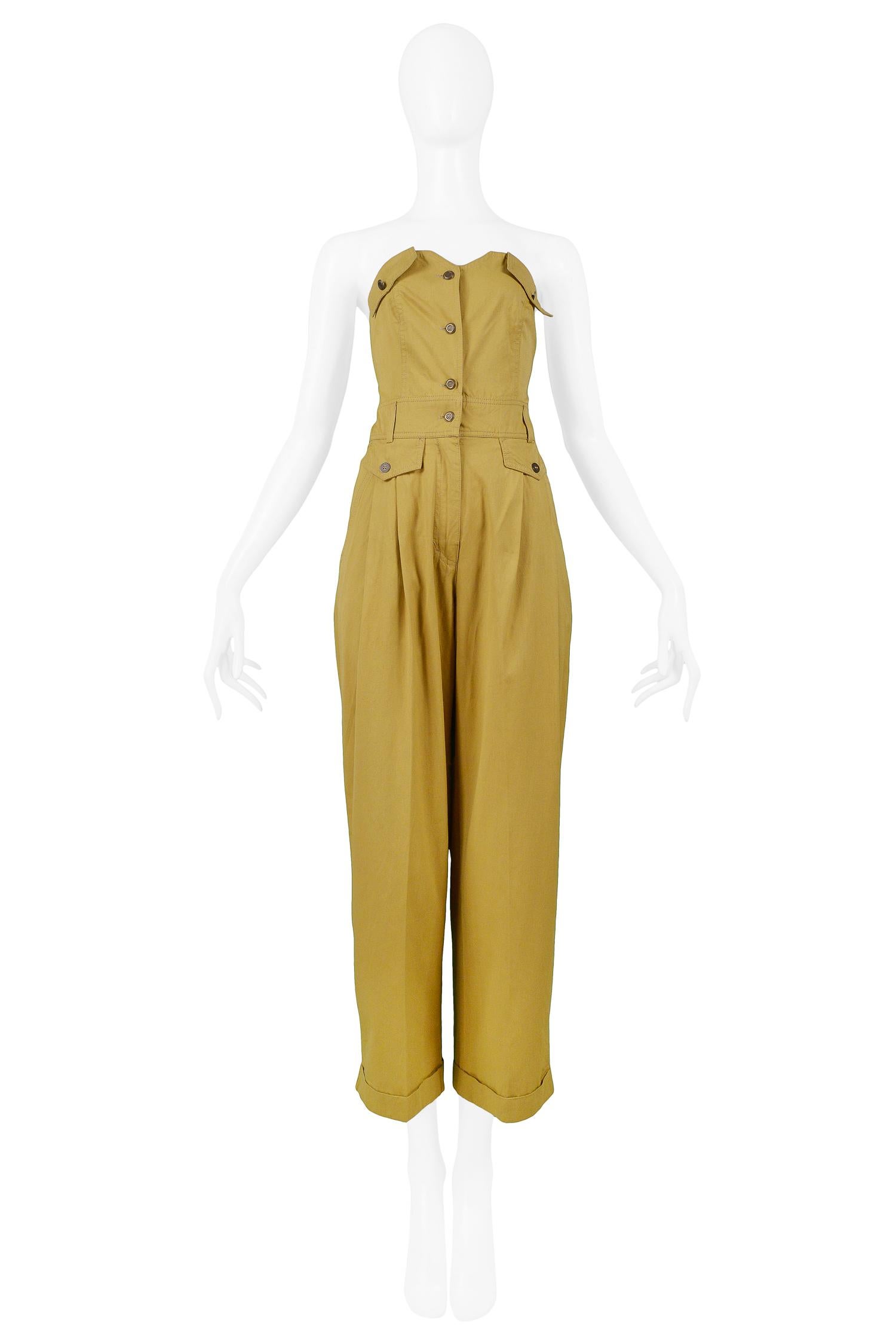 Resurrection Vintage is excited to offer a vintage Byblos khaki cotton strapless jumpsuit with button front, pocket details, pleated pants, and  cuff hems. Circa, 1992. 

Byblos
Designed by Alan Cleaver and Keith Varty
Size 42
Viscose Cotton