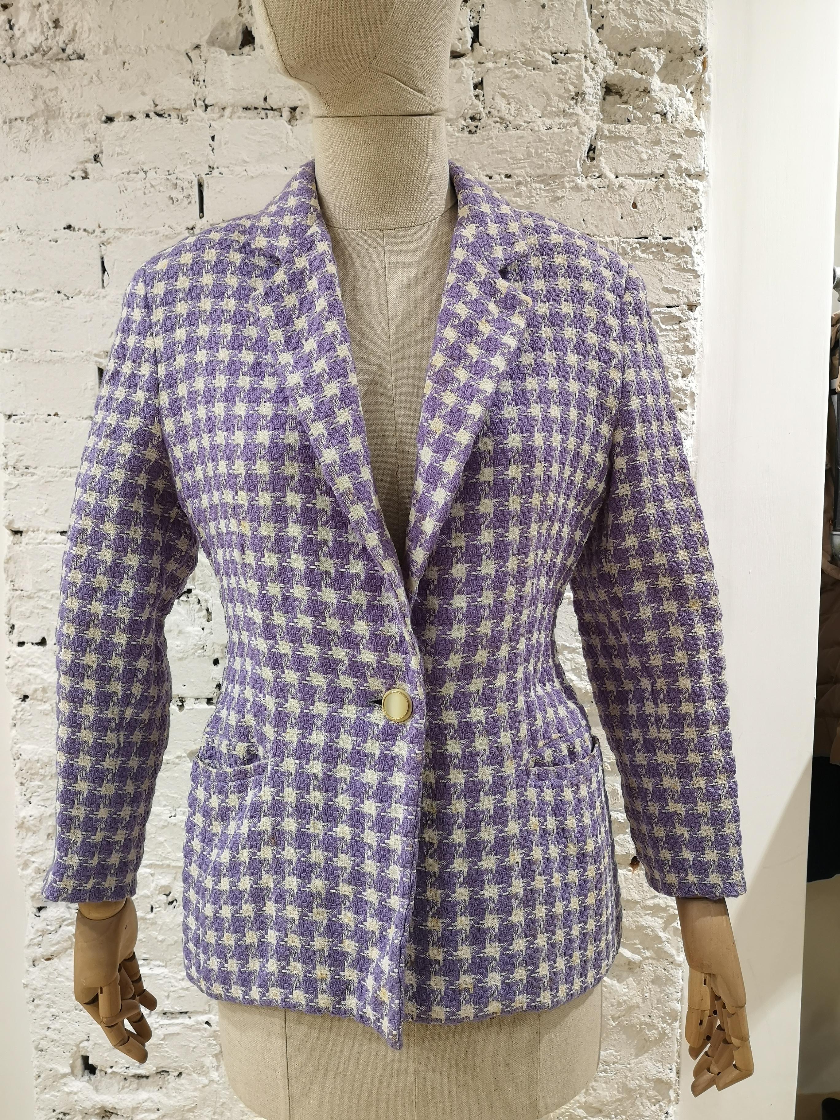 Byblos light purple and white wool jacket
byblos jacket made of wool and viscose
light purple and white some yellow signs 
size 42