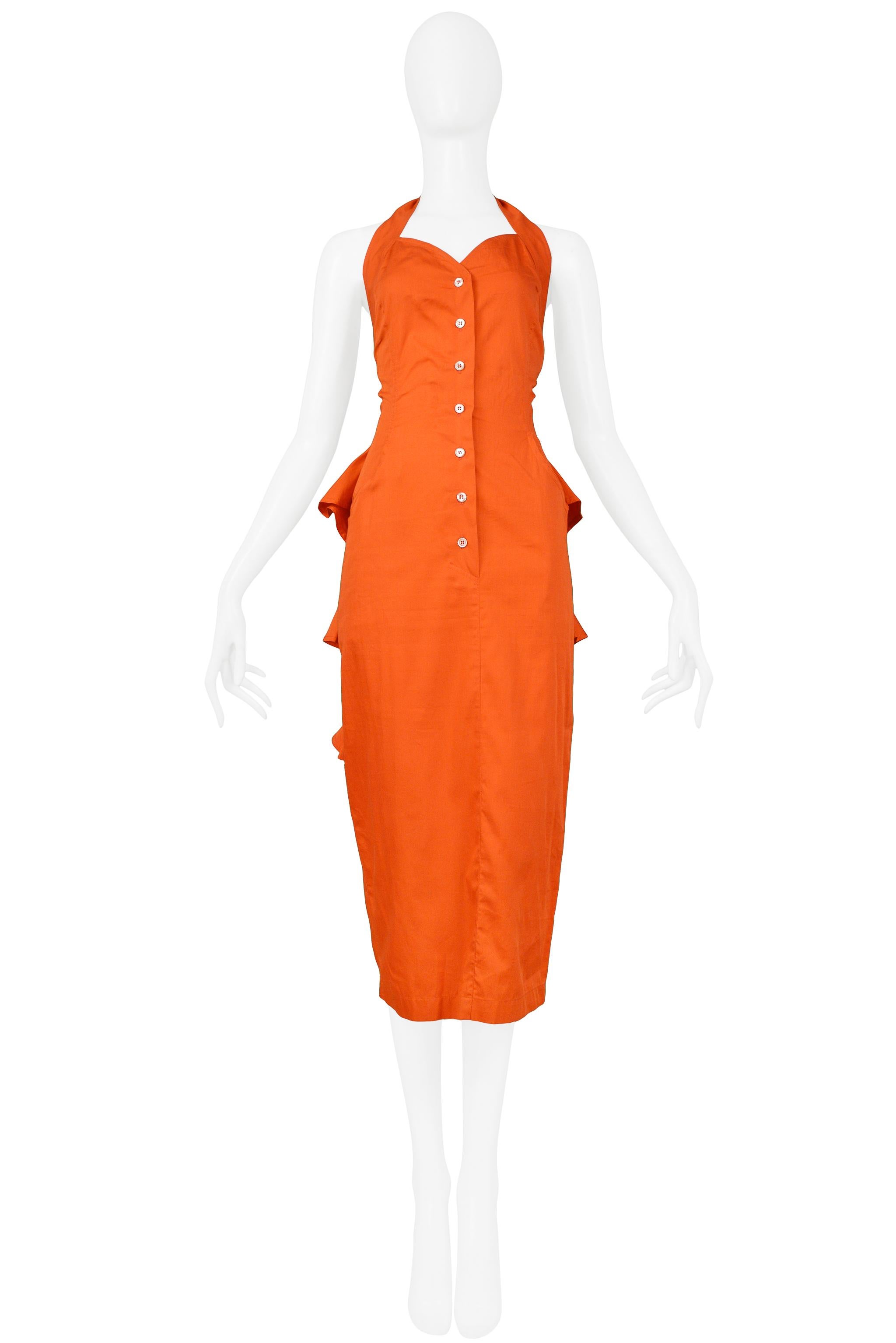 Resurrection Vintage is excited to offer a vintage Byblos bright red-orange Byblos cotton halter dress with a flat front, buttons, halter strap, and skirt with ruffles at back and sides. 

Byblos
Designed by Alan Cleaver and Keith Varty
Size