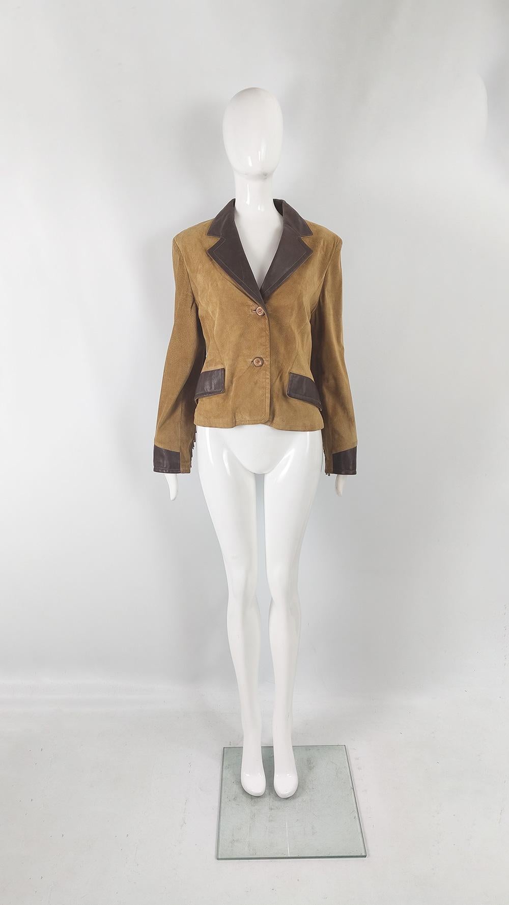 An incredibly cool vintage women's fringe coat from the 80s by luxury Italian label, Byblos - a division of Genny and a label that Gianni Versace was the head designer of in the 70s. In a real, dark brown Italian leather and a tan suede with
