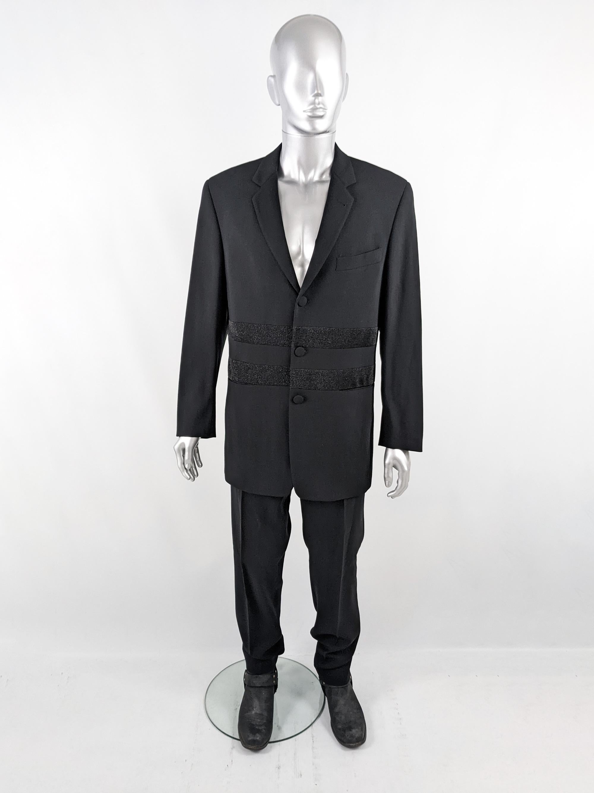 An excellent and rare vintage mens two piece trouser suit from the 80s by luxury Italian fashion house, Byblos (who Gianni Versace was a designer for). Made in Italy from a black virgin wool with a high waist on the trousers and amazing lurex panels