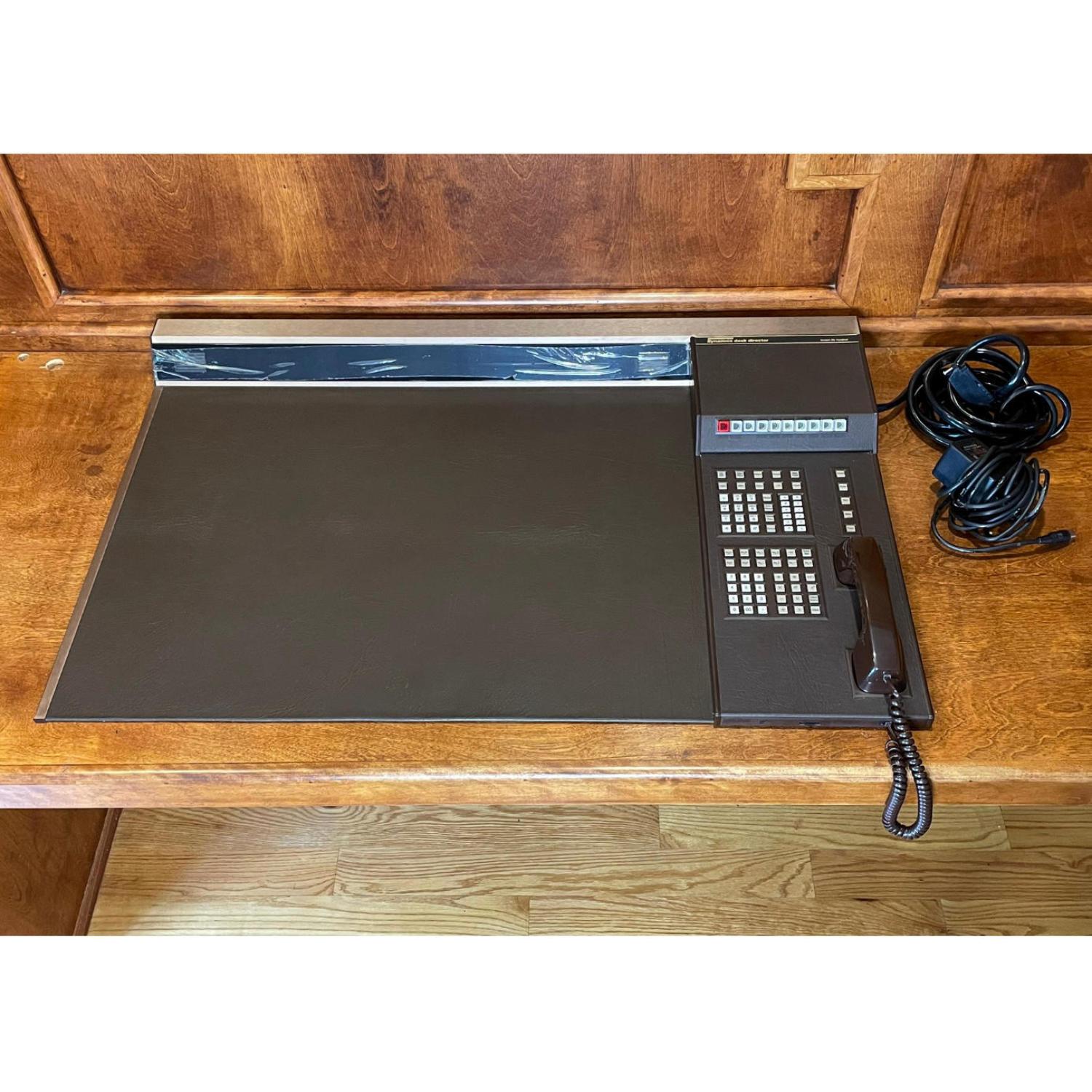 No status seeking, 1980s Wall Street executive should be without this leather bound desk apprentice. More than just a novelty item, this is a rare piece of tech and design history. If you can't afford a DeLorean, this desk director is the next best