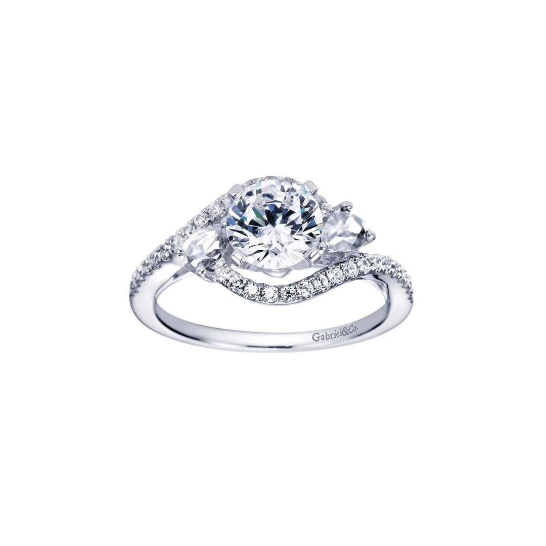 Bypass Floating Halo Diamond Engagement Ring in 14k White Gold.﻿ Delicate and airy curves wrap elegantly around the center diamond and the clusters of diamond florettes on the sides. Center diamond weighs 0.76 ct, J color, VS2 clarity. Side diamonds