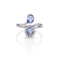 Bypass Ring in 18Kt White Gold with Two Very Peri Sapphires and Diamonds Halo