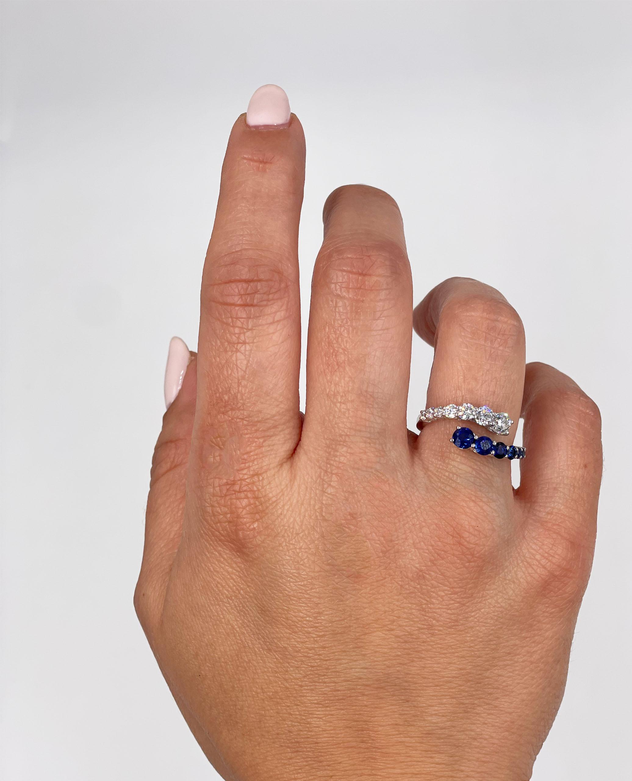 Bague bypass en or blanc 14K avec 7 diamants ronds de taille brillant pesant 0,73 carat au total et 7 saphirs ronds à facettes pesant 1,15 carat au total.  

- Les diamants sont de couleur G/H et de pureté VS2/SI1.
- Taille 6.5, peut être augmentée