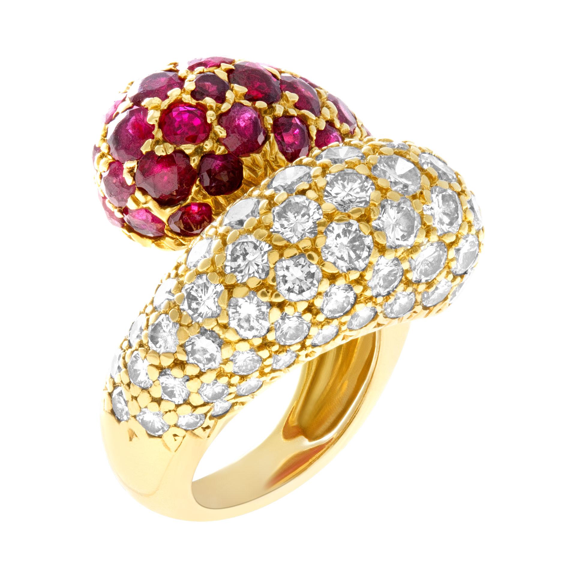 Lovely bypass ruby & diamond ring in 18k yellow gold with approxiimately 2.5 carats in diamonds and 3 carats in rubies. Width: 19.5mm. Size: 3.0 .  This Ruby ring is currently size 3 and some items can be sized up or down, please ask! It weighs 7.6