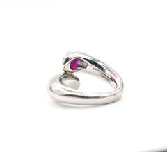 Anello Bypass con rubino e diamante in platino 900
