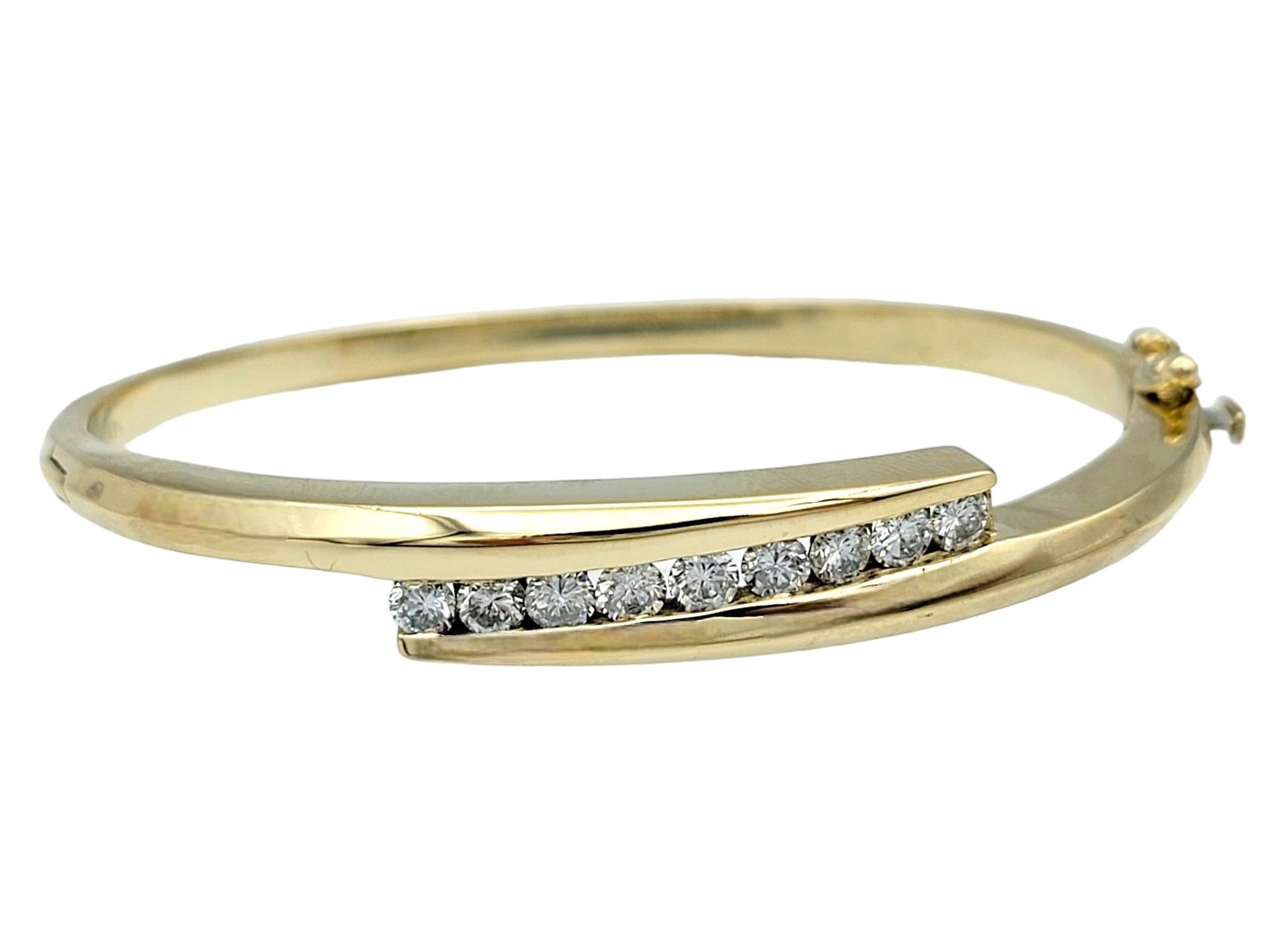 Contemporary Bypass Style Hinged Bangle Bracelet with Round Diamonds in 14 Karat Yellow Gold For Sale