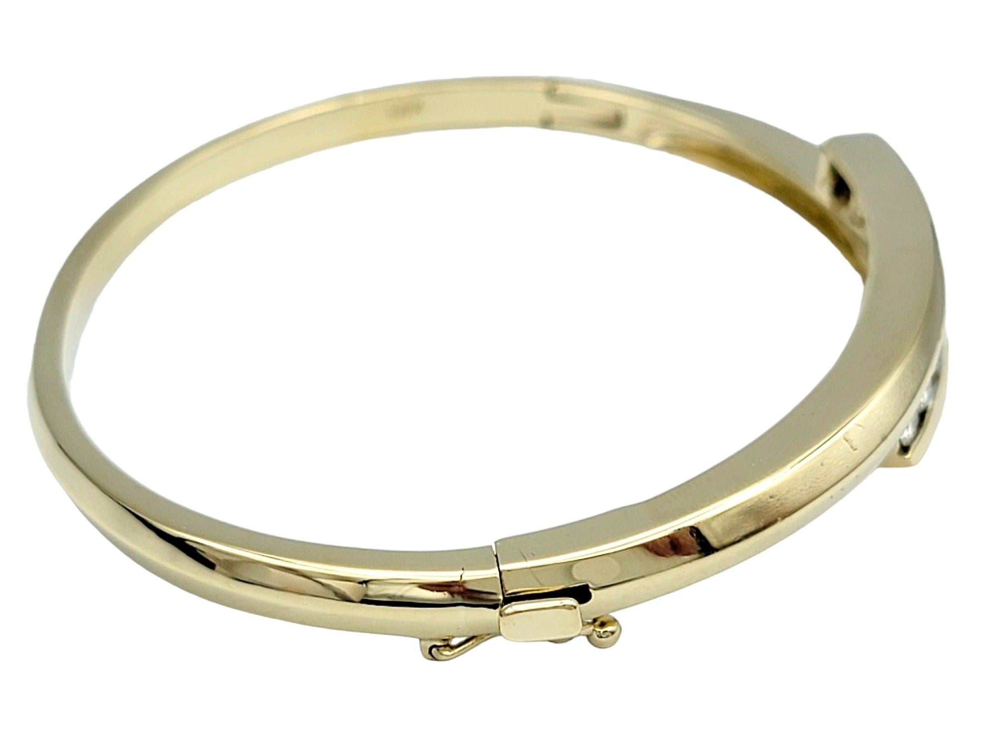 Women's Bypass Style Hinged Bangle Bracelet with Round Diamonds in 14 Karat Yellow Gold For Sale