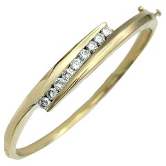 Bypass Style Hinged Bangle Bracelet with Round Diamonds in 14 Karat Yellow Gold
