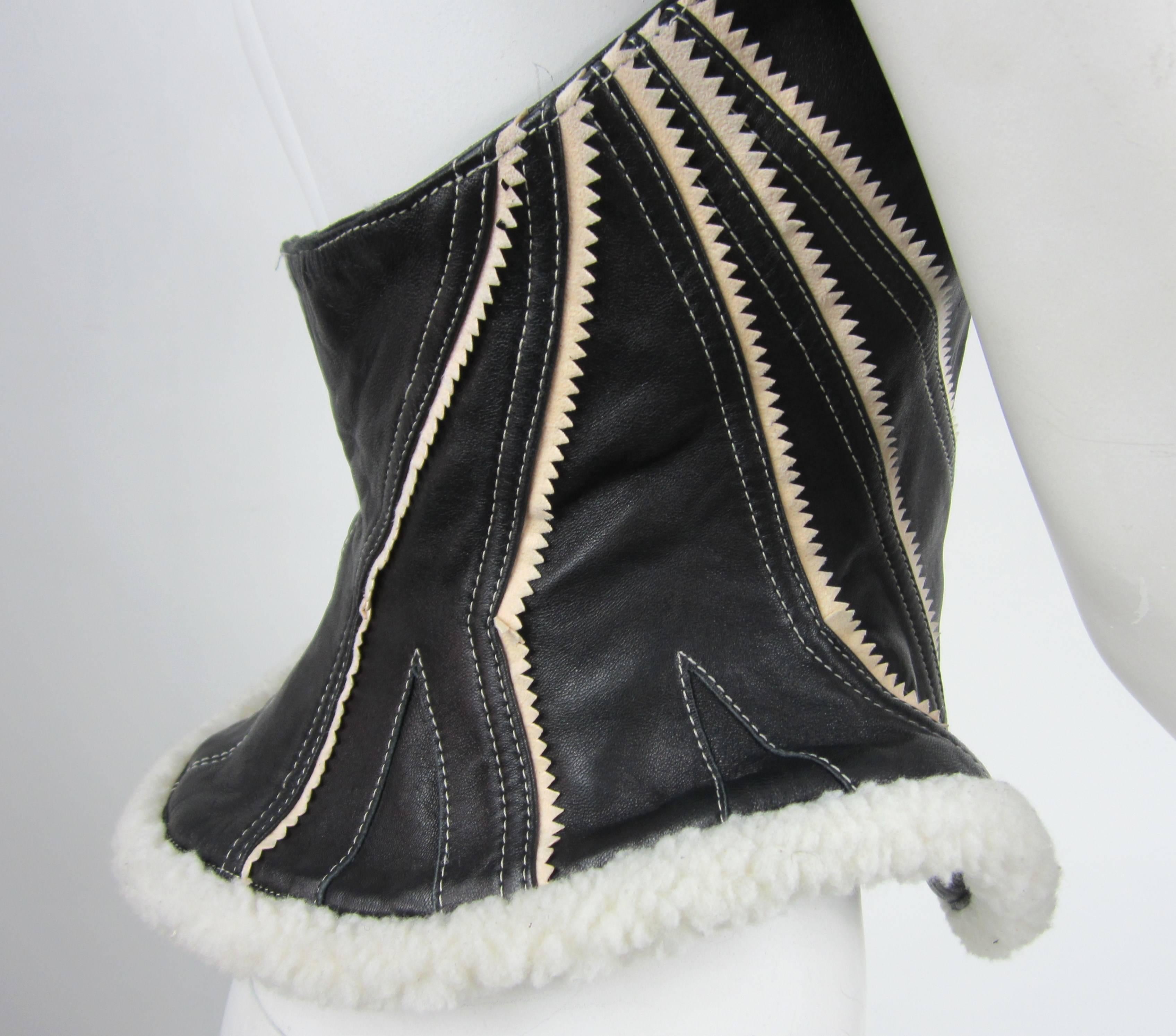 Black Lambskin and white Shearling make up this Byron Lars Vest. Tie up the front, can be worn alone or over something worn in a sci-fi  movie. Bust is up to 34-36. Waist up to 31in. Size Small. Please be sure to check our storefront for more