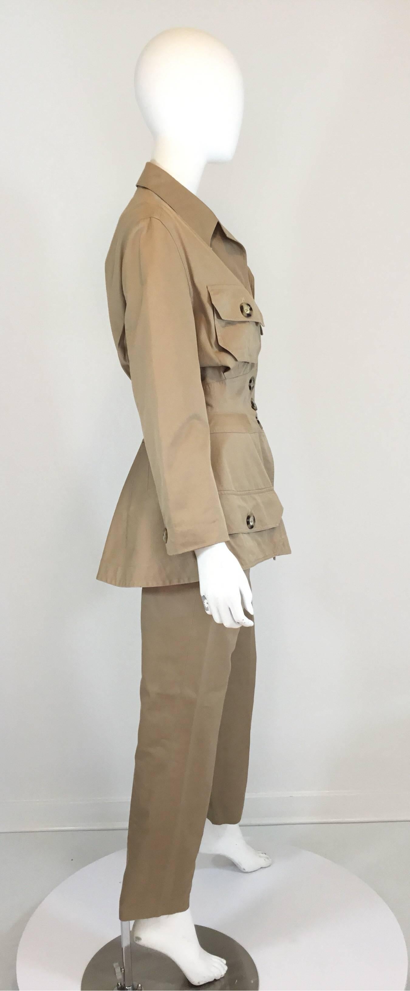 Byron Lars pant and jacket set has button closures at the front of the jacket with tortoise-like button closures and 4 patch pockets. Exagerated design with nipped waist and large buttons.  Pants have a back zipper fastening and are fully lined.