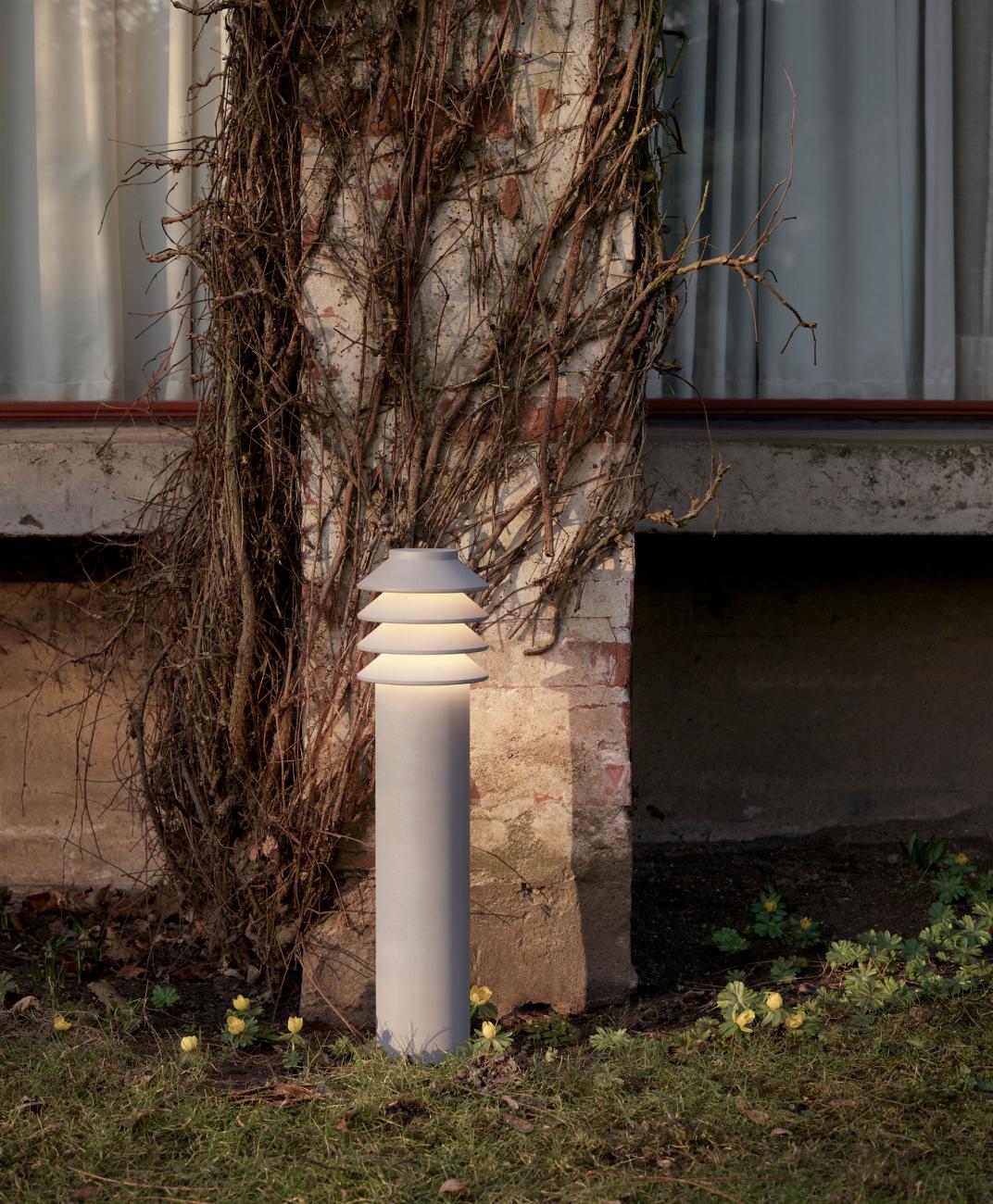'Bysted Garden Short' Outdoor Bollard Light for Louis Poulsen in Aluminum

'Bysted Garden' is a downscaled version of Peter Bysted's award-winning bollard. Its four rings provide a gentle glow, while their white underside creates a reflection which