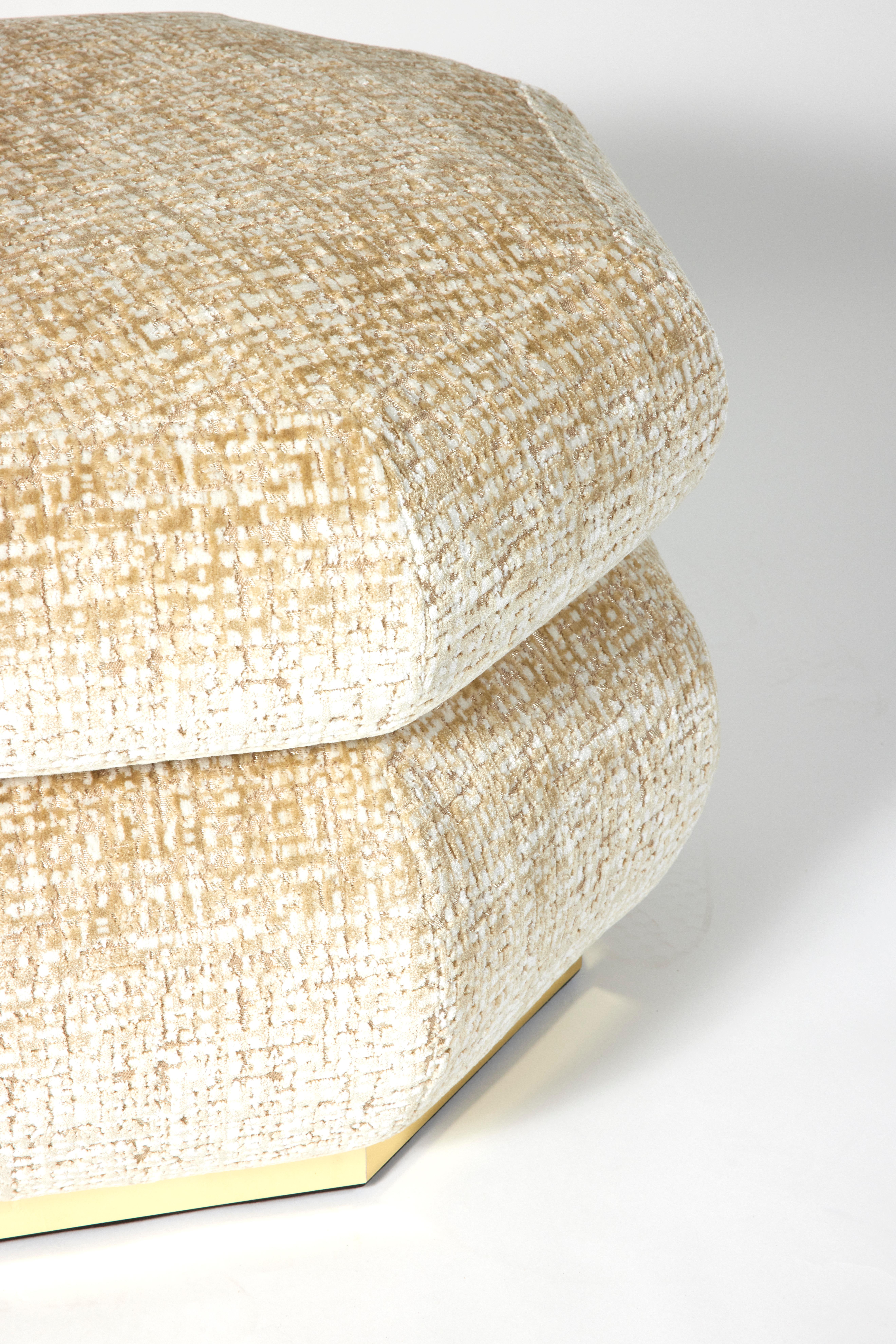 The 2-tiered octagonal Byzance pouf is made with an oak structure, high-density foam, and upholstered in a cream-white textured velvet (LG.FB-37) with a base made of brushed brass.

Made in France.
