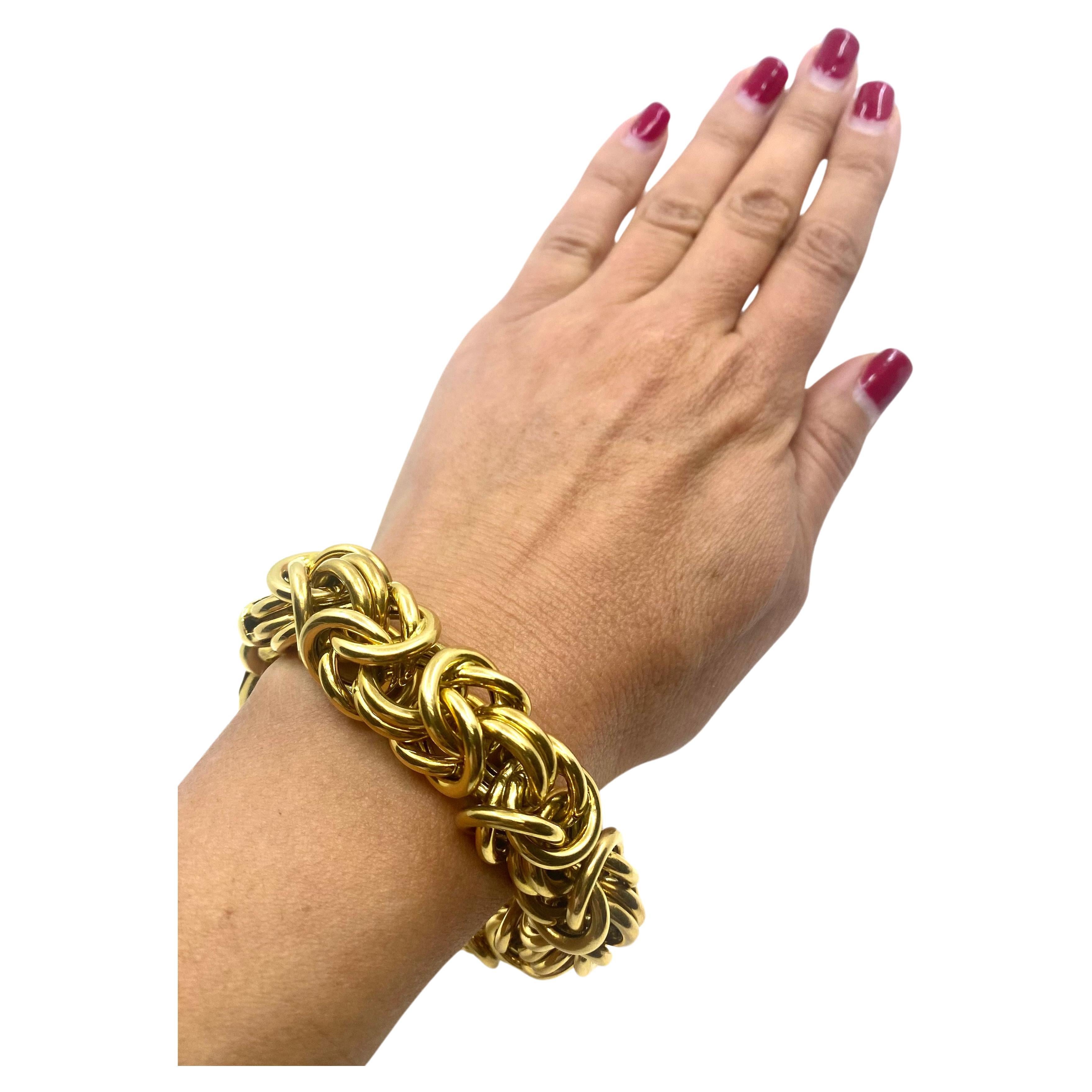 
CIRCA: 1990’s
MATERIALS: 18k Yellow Gold
WEIGHT: 114 grams
MEASUREMENTS: 8 1/2” x 3/4”
HALLMARKS: 18K, Italy

ITEM DETAILS:
A gorgeous Byzantine bracelet, made of 18k gold in Italy. 
It’s a chunky yet airy piece with a substantial clasp. The clasp