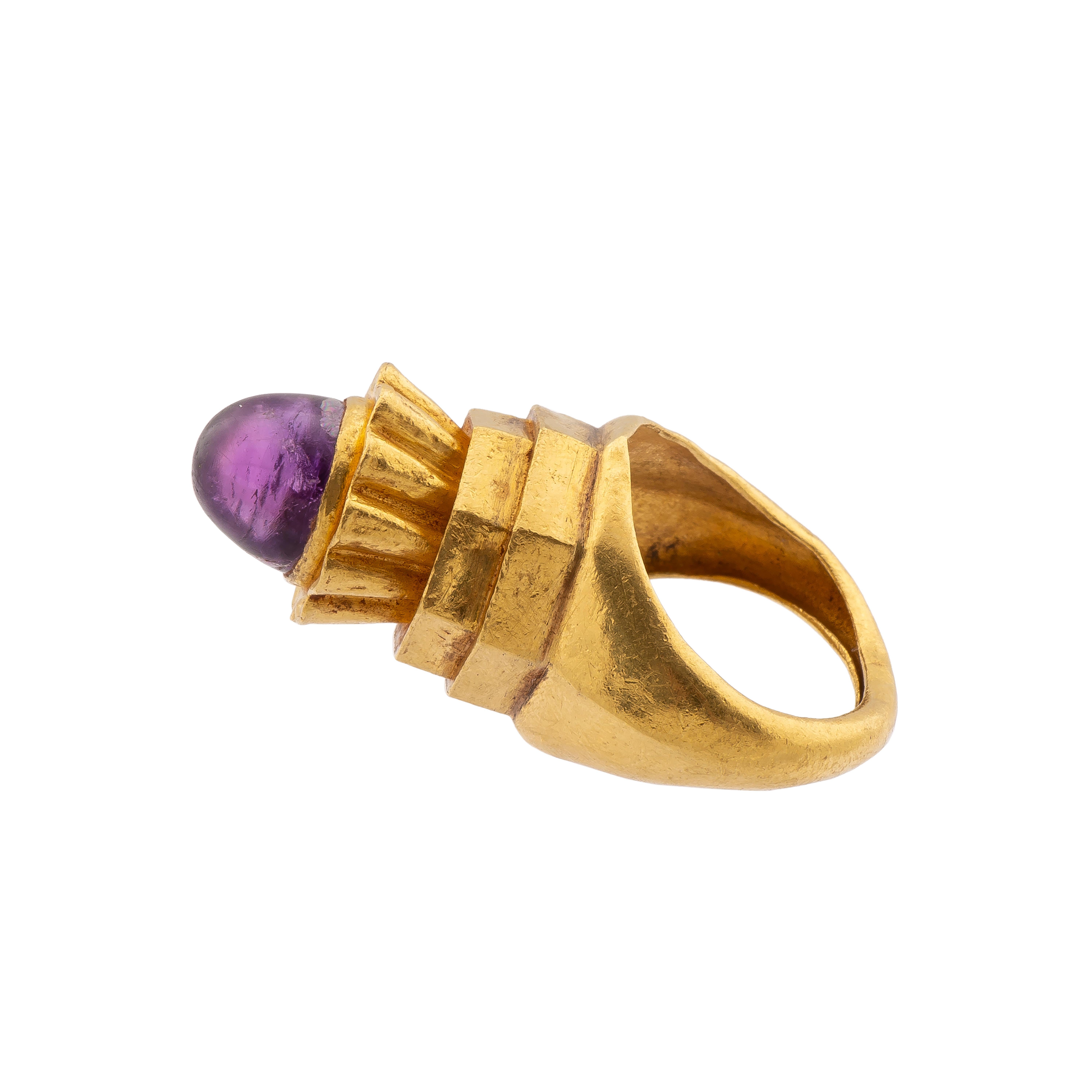 Byzantine Gemstone Ring Set with an Amethyst  
Byzantium, c. 500 AD  
Weight 13.0 gr.; bezel 15.8 x 17.5 x 21.8 mm.; circumference 55.76 mm.; US size 7.5; UK size P  

Bold heavy ring with a deep violet amethyst – uncut but polished – set in a