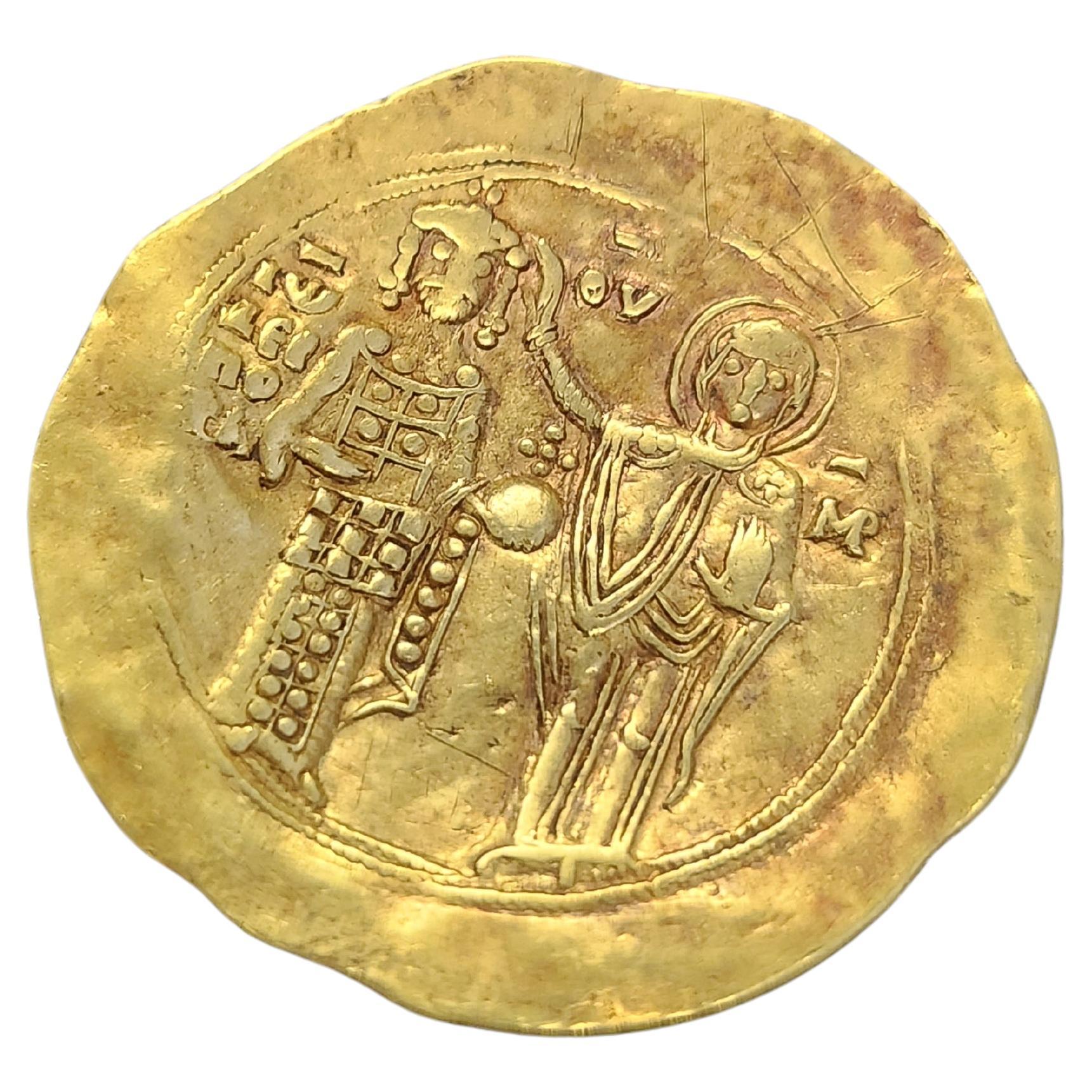 Pièce en or fin de l'époque byzantine pouvant être utilisée comme pendentif datant de 1221-1254 souverain john 111 doukas vatatzes et vierge nimbée empereur et autre pièce côté christ assis sur un trône sans dossier. 