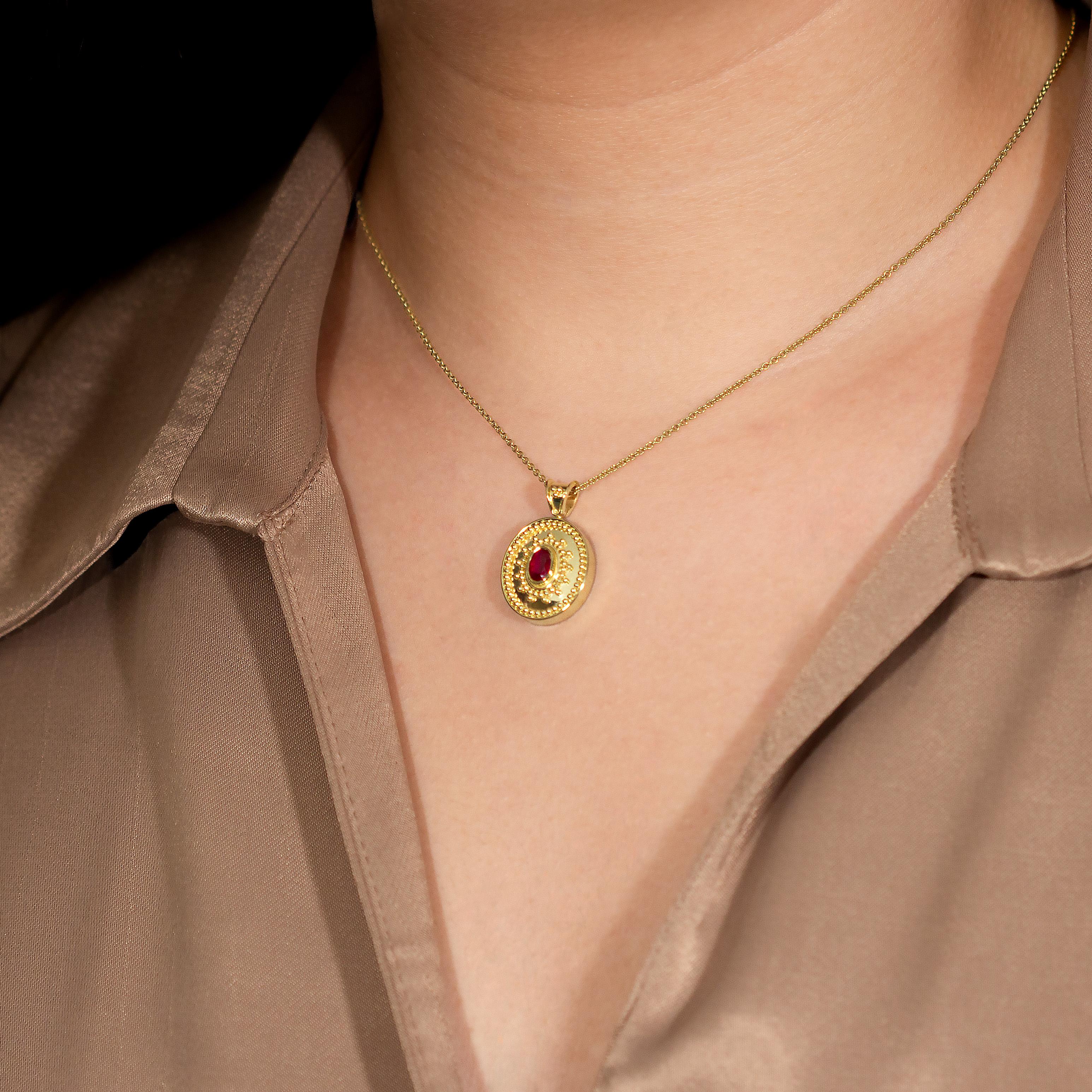 Adorn yourself with our gleaming oval gold pendant, showcasing a captivating oval deep red ruby encircled by a symphony of meticulously crafted granulations, A symbol of timeless elegance and enduring allure.

100% handmade in our workshop.

Metal: