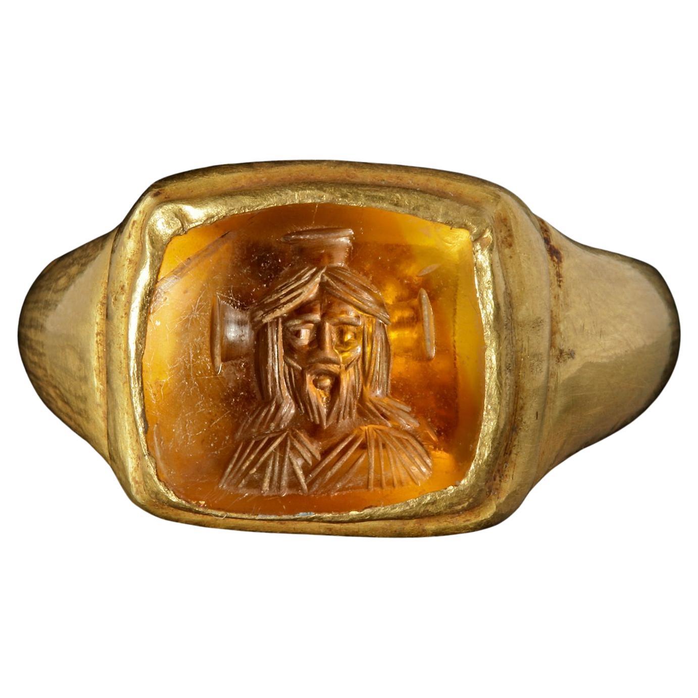 Byzantine Gold Ring With A Topaz Intaglio With A Bust Of Christ 7th Century For Sale
