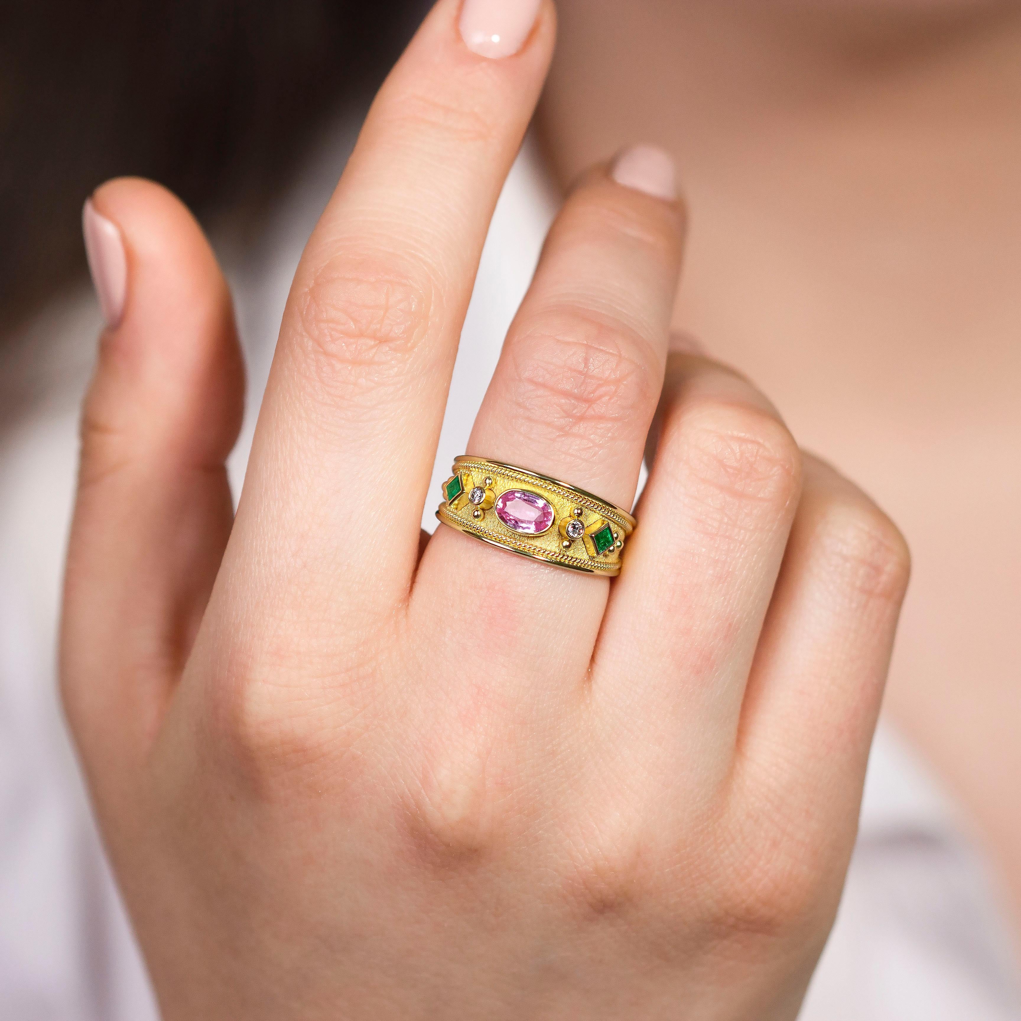 A gold ring adorned with two square emeralds on either side, beautifully complemented by a captivating oval sapphire—a harmonious symphony of color and timeless charm to wear on your hand.

100% handmade in our workshop.

Metal: 18K Gold
Gemstones: