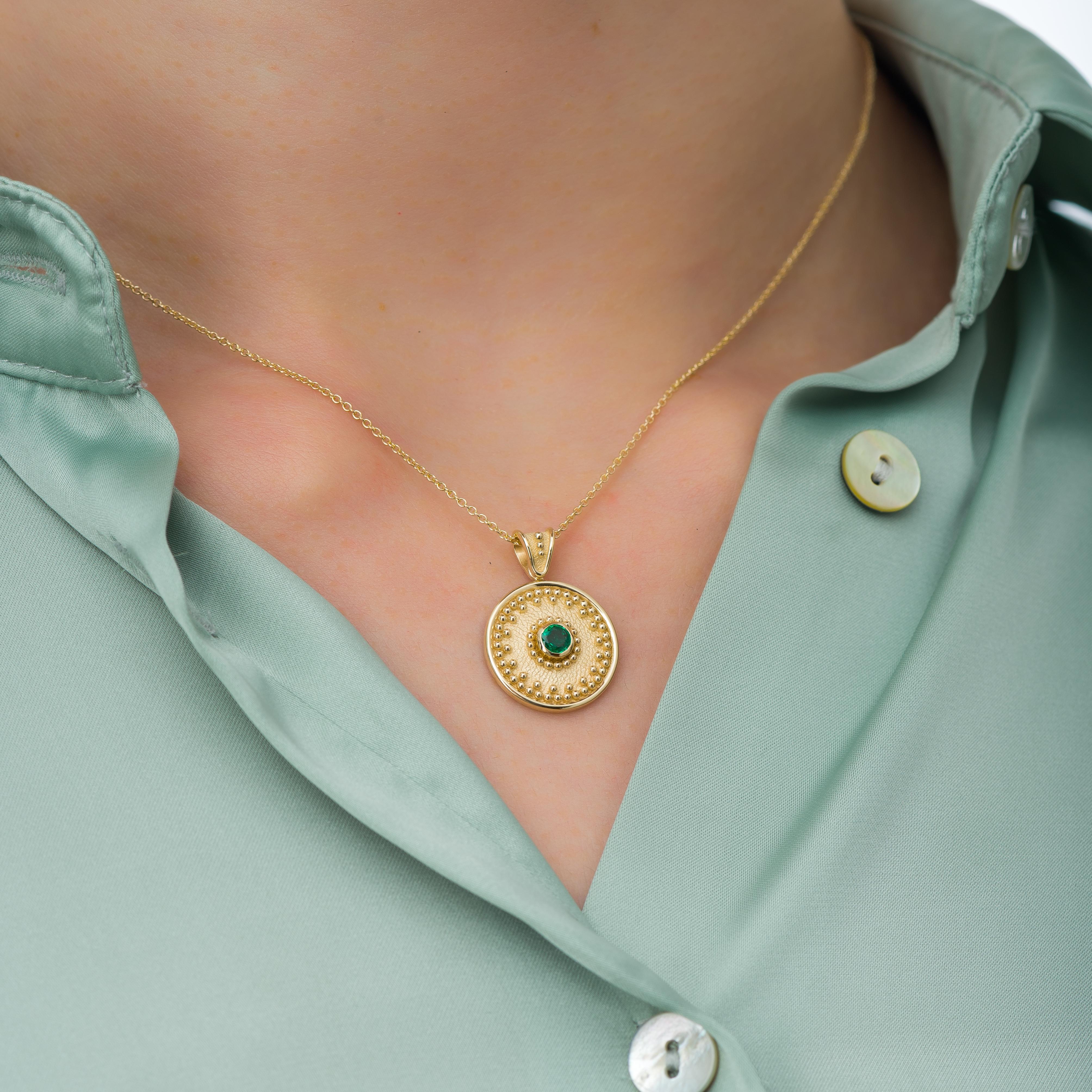 Embrace the sophistication of a round gold pendant, showcasing the radiant beauty of a central emerald encircled by meticulously crafted granulations—a symbol of timeless beauty and intricate craftsmanship that exudes timeless charm.

100% handmade