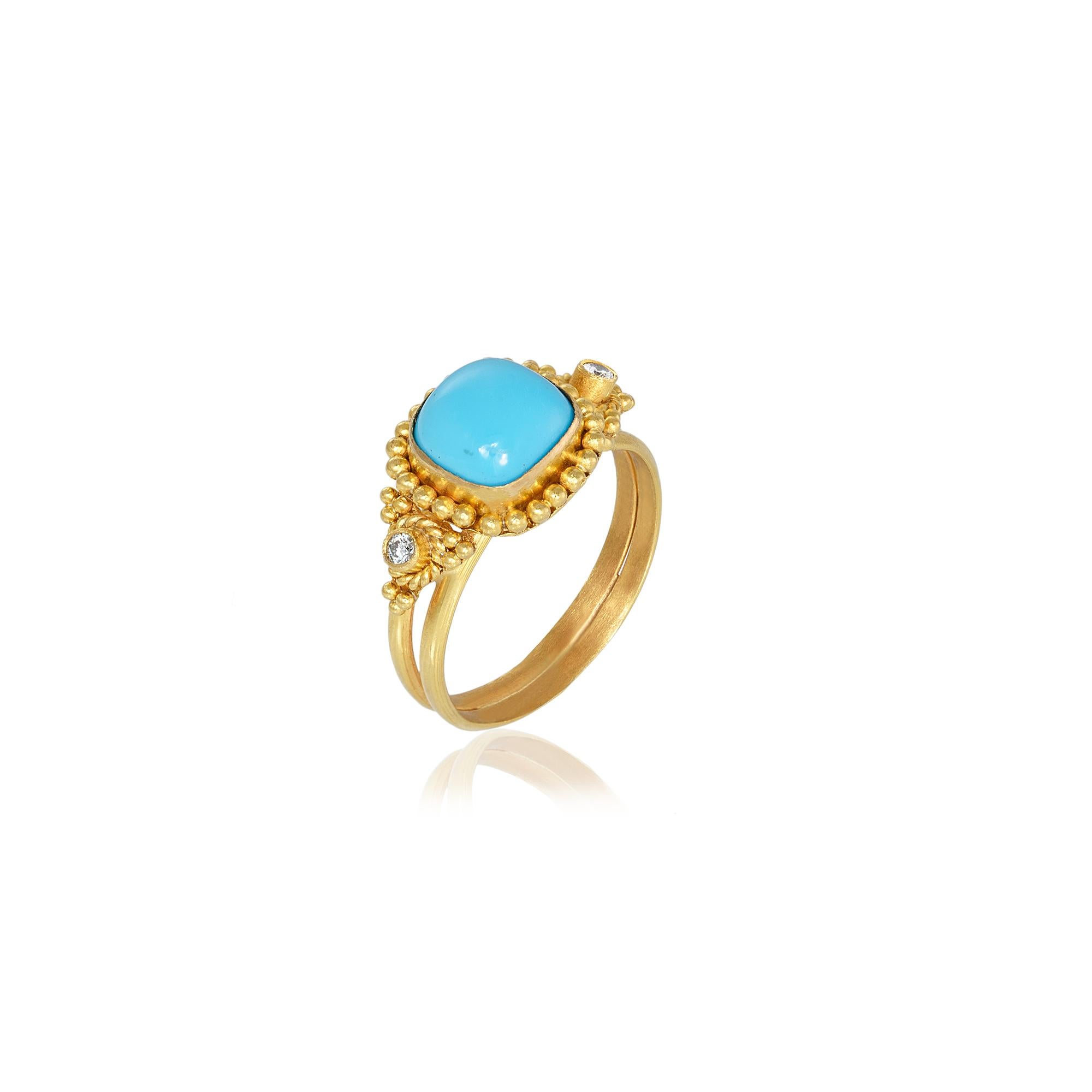 Byzantine Granulation ring handcrafted in 22Kt yellow gold, featuring a Cabochon Turquoise center and two brilliant cut diamonds. The double base of the ring, the blue of the Turquoise and the elegant combination of granulation and filigree