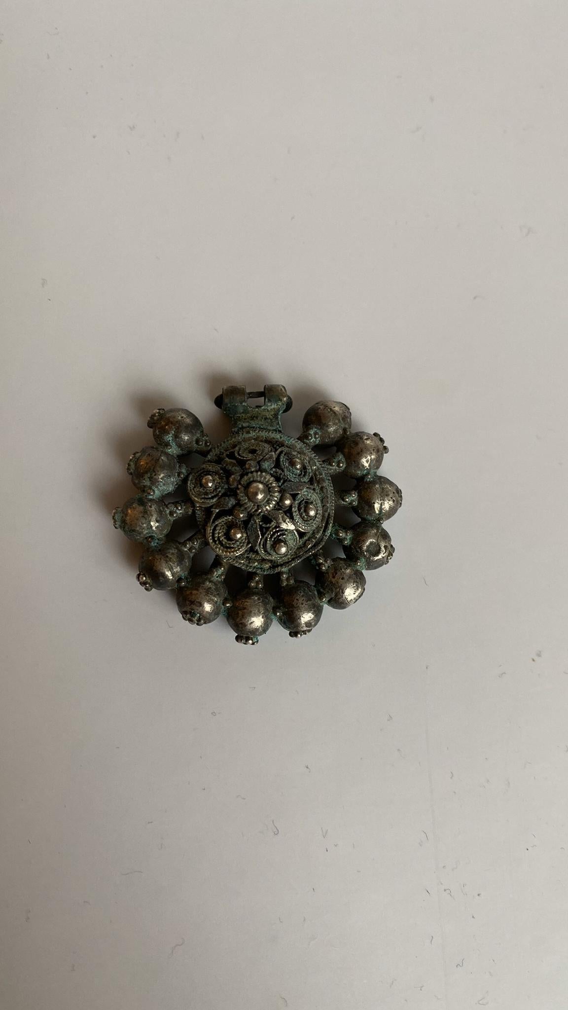 Authentic pair of earrings ('arpalii) comes from its origin town Vidin in Bulgaria.
Silver-gilt, in the form of a central rosette with applied beadwork, surrounded by a series of rod and bead elements all with pattern grainwork or granulation,