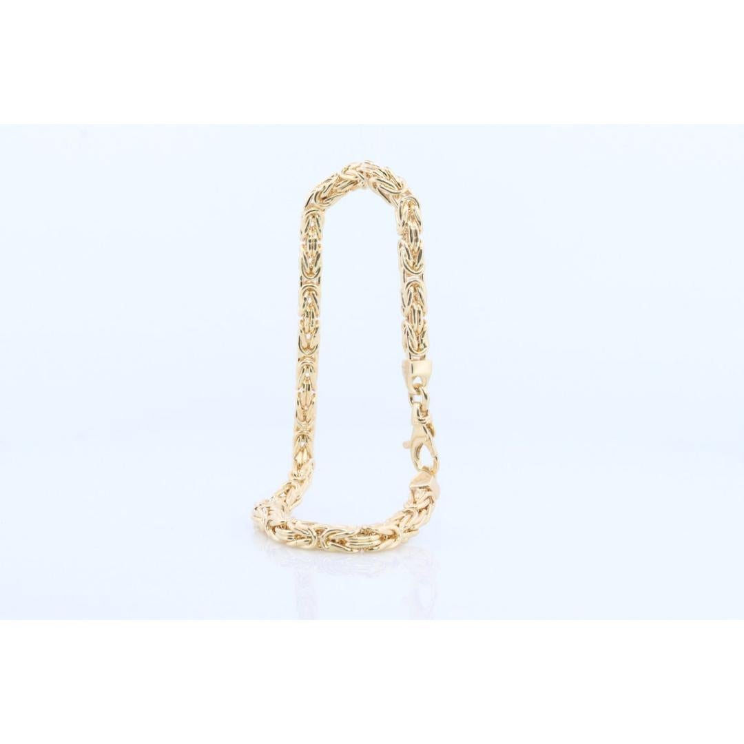 Vintage from the 1990s
Materials: Gold
Chain style: Byzantine
Style: Mid-century

Bracelet width: 4 Millimeters; Bracelet length: 7.5 Inches

Stylish Byzantine chain bracelet. Solid 14k Yellow gold made in ITALY. Hallmarked 14k Italy. Square Solid