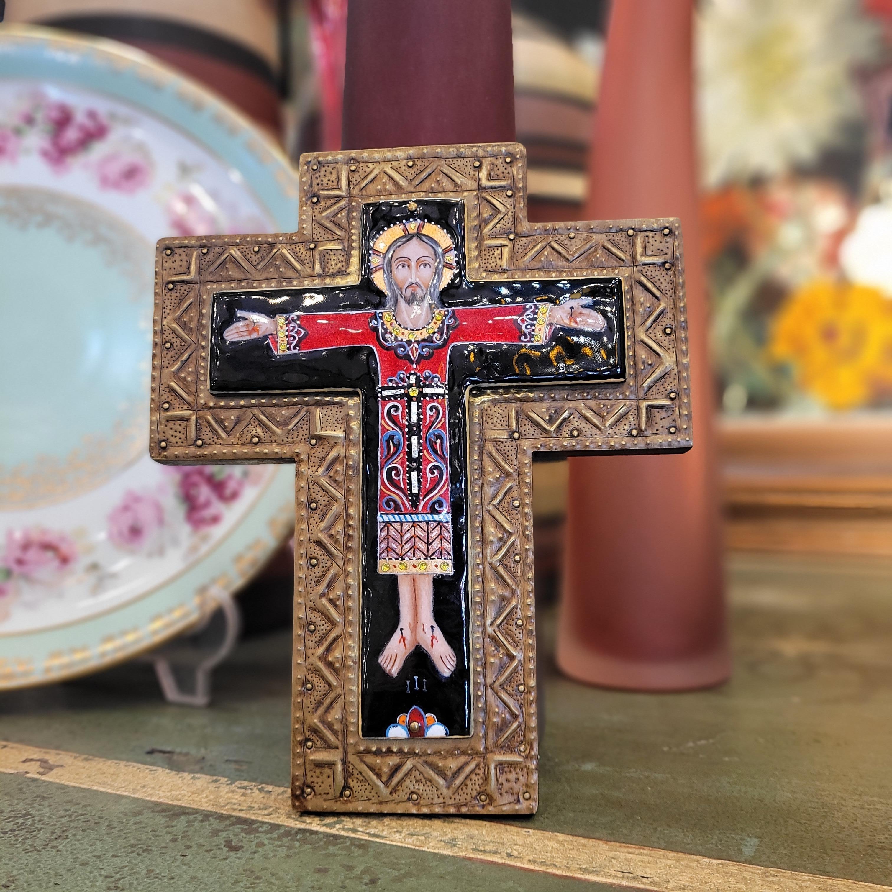 Exquisite  and very refined Image of a Byzantine Cross made of fired enamel in beautiful burgundy colors, blue gold with intarsia of semi-precious stones and mother of pearl, the entire piece is handcrafted. The cross is in high relief on a wooden