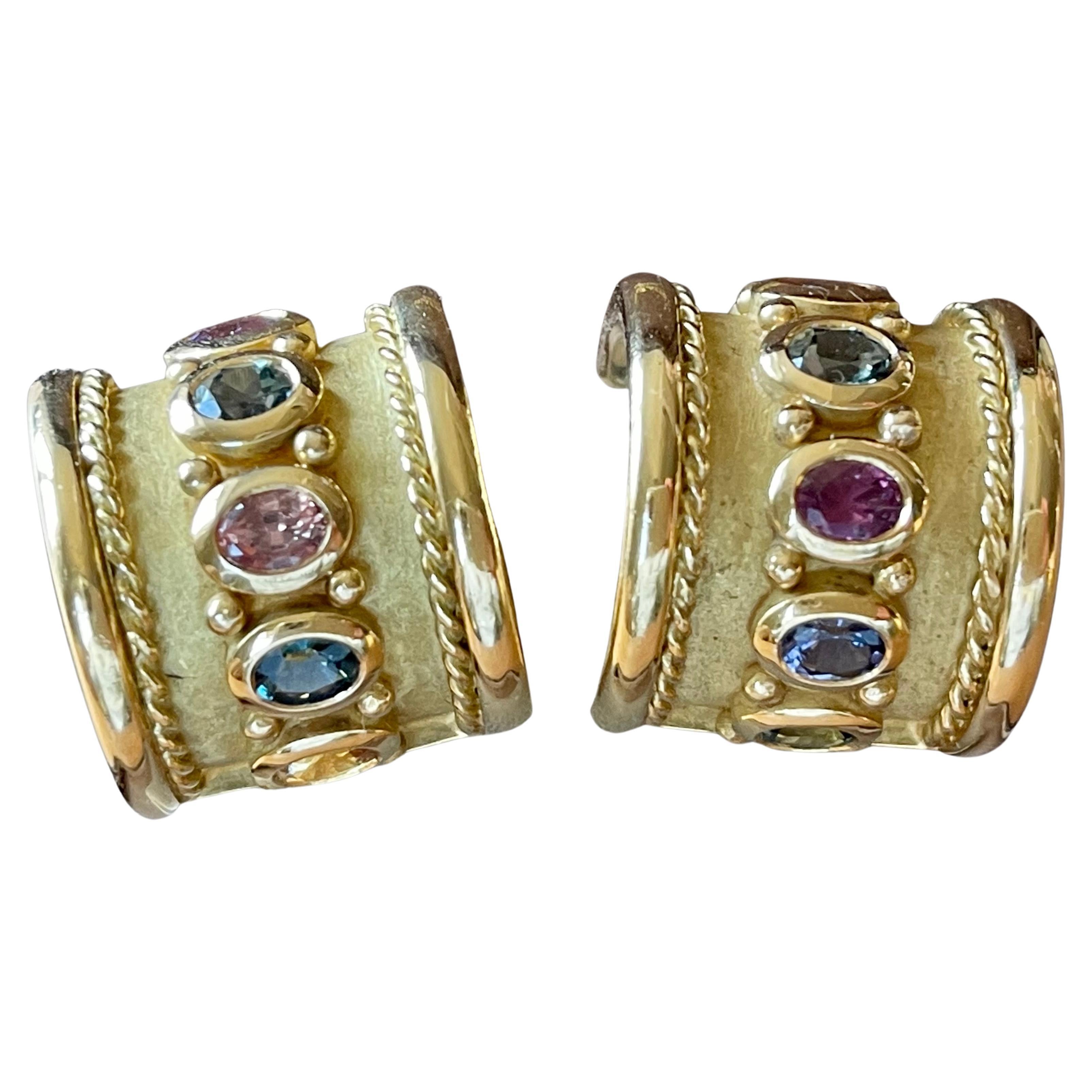 Very lovely handmade 18 K yellow Gold earclips featuring 12 fancy colored Sapphires weighing approximately 10 ct. 
Length: 2 cm
Width: 1.9 cm
Weight: 38.69
Masterfully handcrafted piece! Authenticity and money back is guaranteed.   
For any