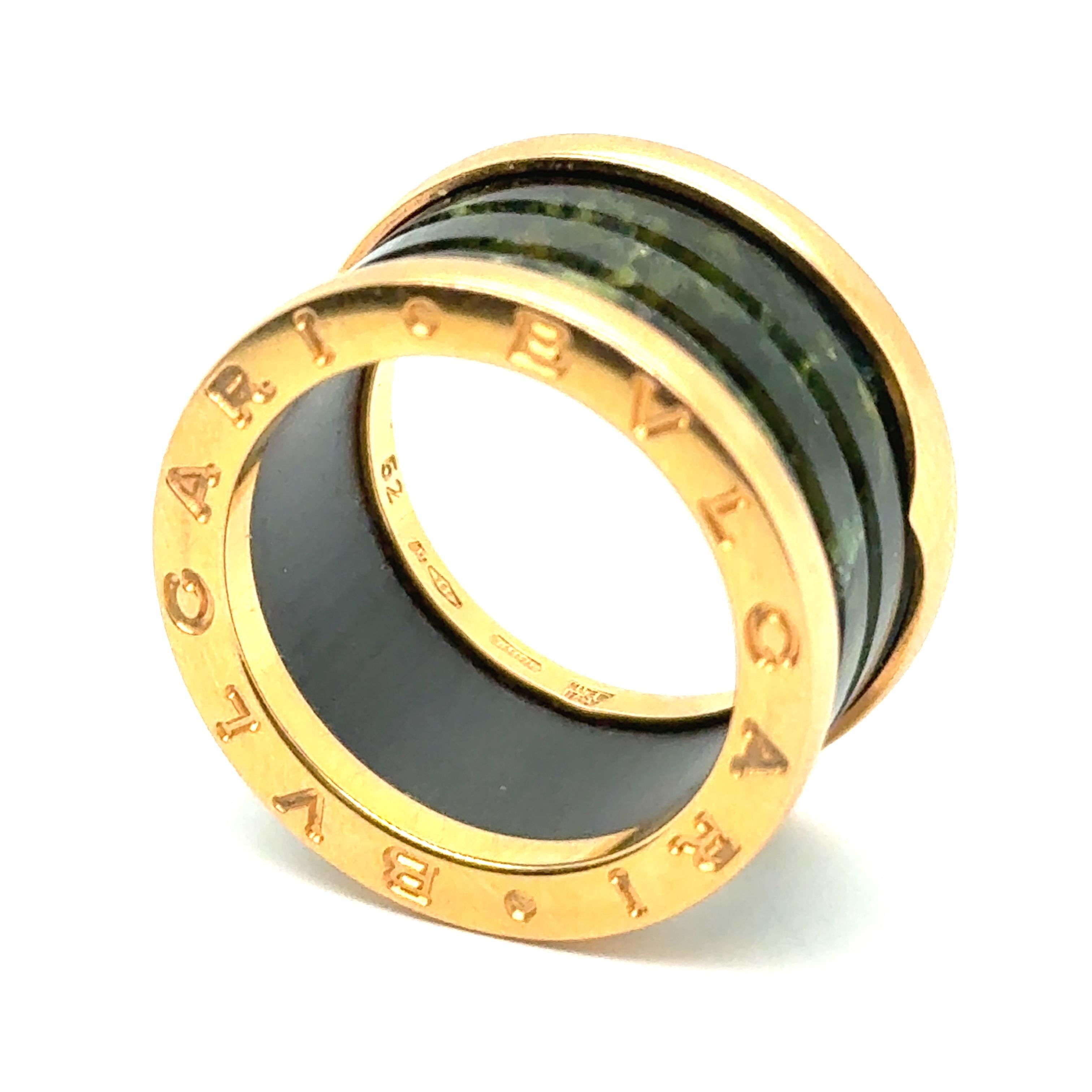 The Bvlgari BZero1 Ring with Serpentine in 18 Karat Red Gold is a stunning reinterpretation of one of the brand's most iconic designs.  First introduced in 2000, the BZero1 collection revolutionized luxury jewelry, drawing inspiration from Rome's